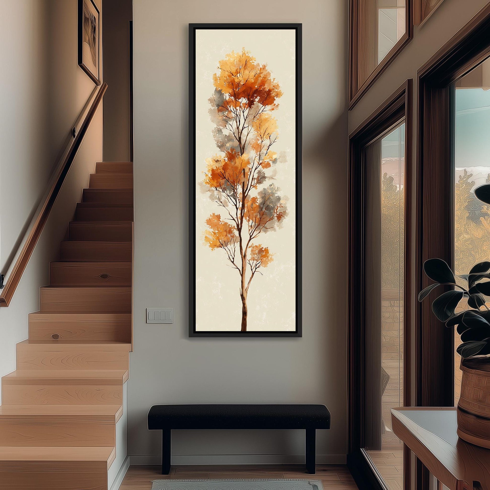 a hallway with a large painting of a tree hanging on the wall, a wooden staircase, a black bench, and a window with a view of trees outside.