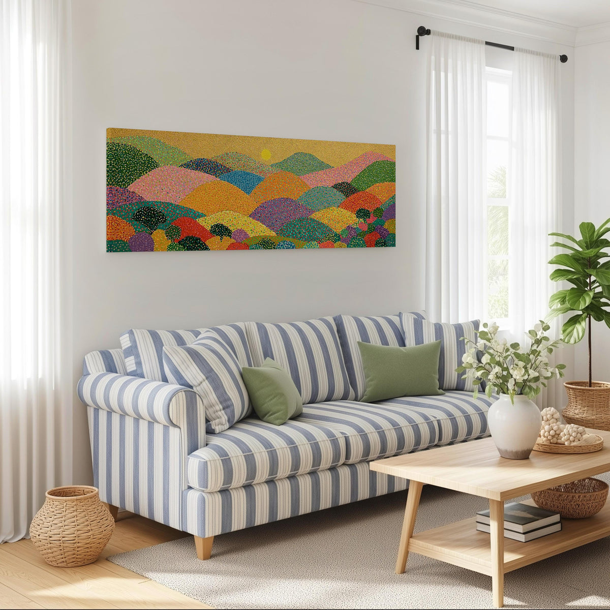 Dotted rainbow hills at sunset long horizontal canvas print above a striped sofa in a coastal living room