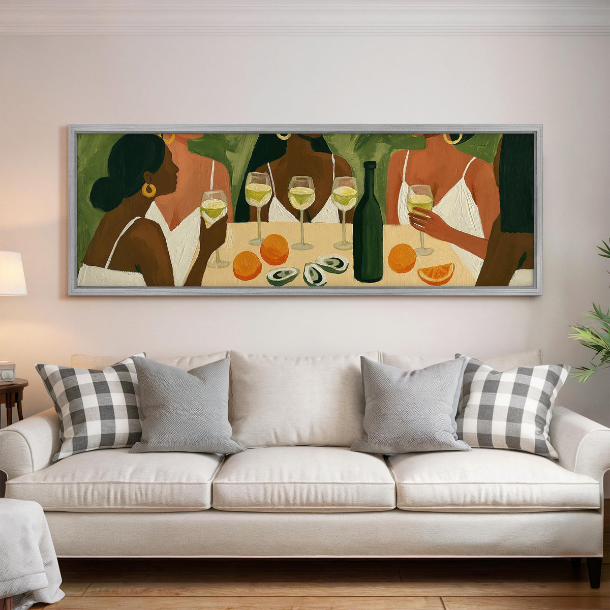 Friends toasting with white wine panoramic canvas print above a white sofa in a bright living room