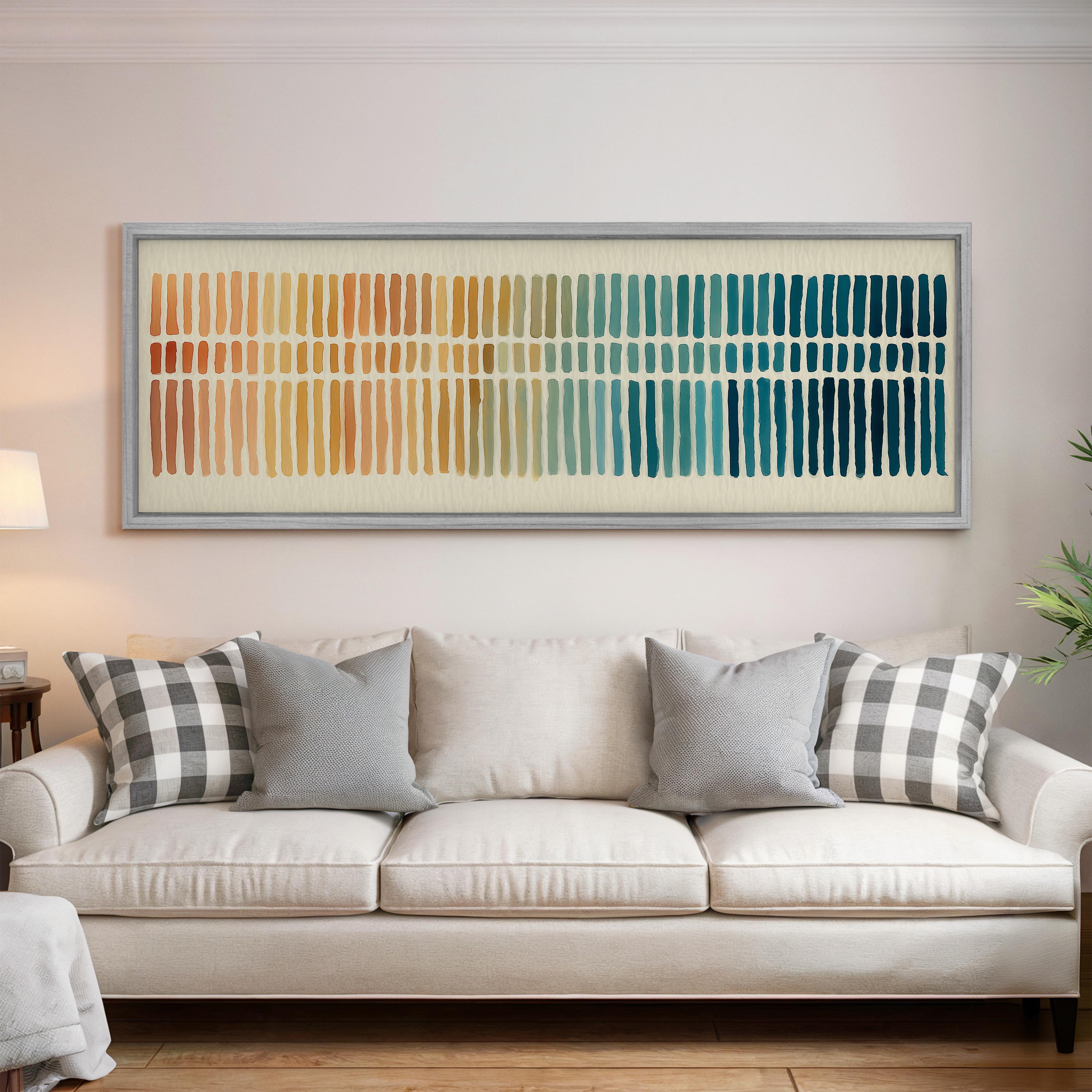 a living room with a white sofa and a large abstract painting hanging on the wall above it.