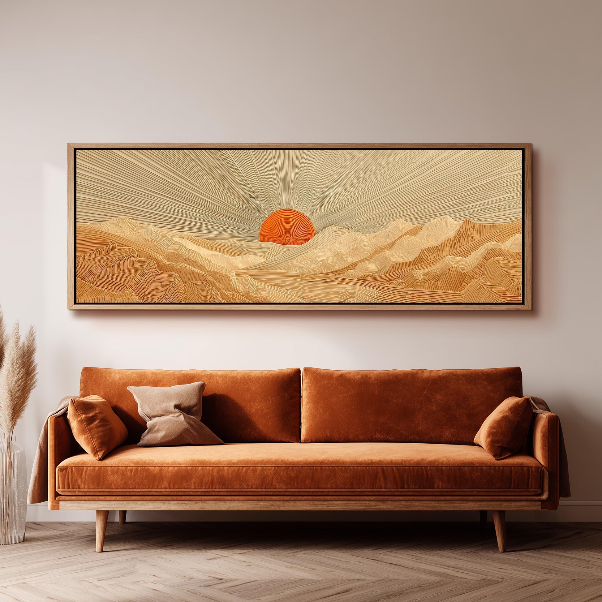 a large, rectangular painting hanging on a wall above a brown sofa.