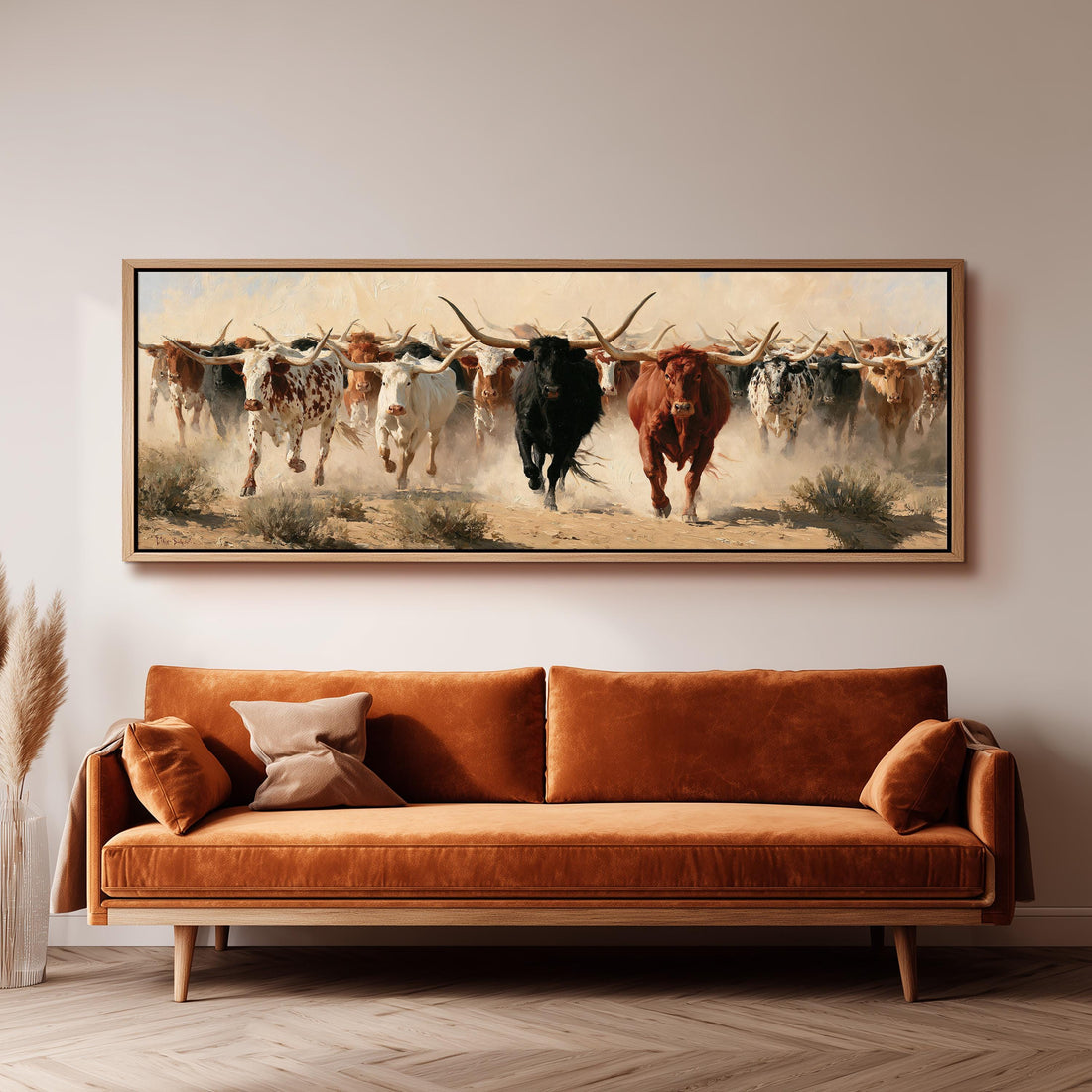 Longhorn cattle stampede long horizontal canvas print above a sofa in a living room