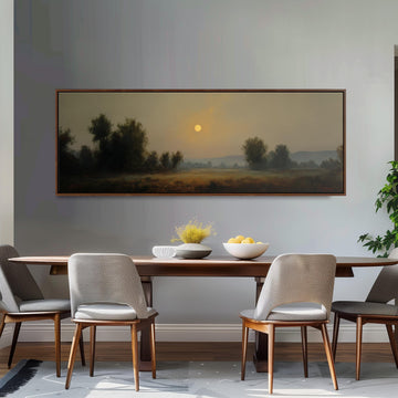 a dining room with a large painting of a landscape hanging on the wall above a wooden dining table with four chairs. The painting depicts a serene countryside scene with a sunlit sky and trees in the distance.
