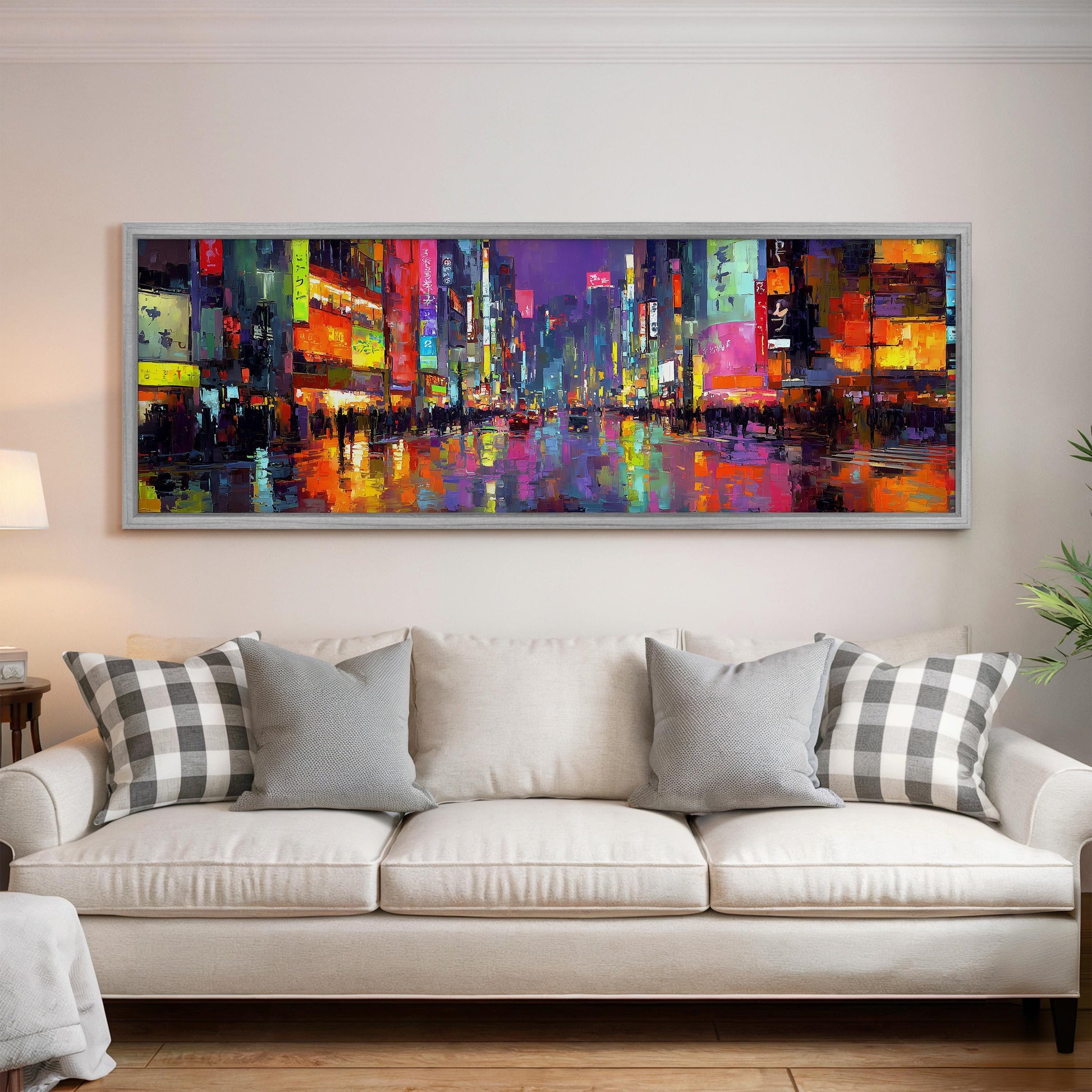 a large, colorful painting of a cityscape hanging on a wall above a white couch in a living room.