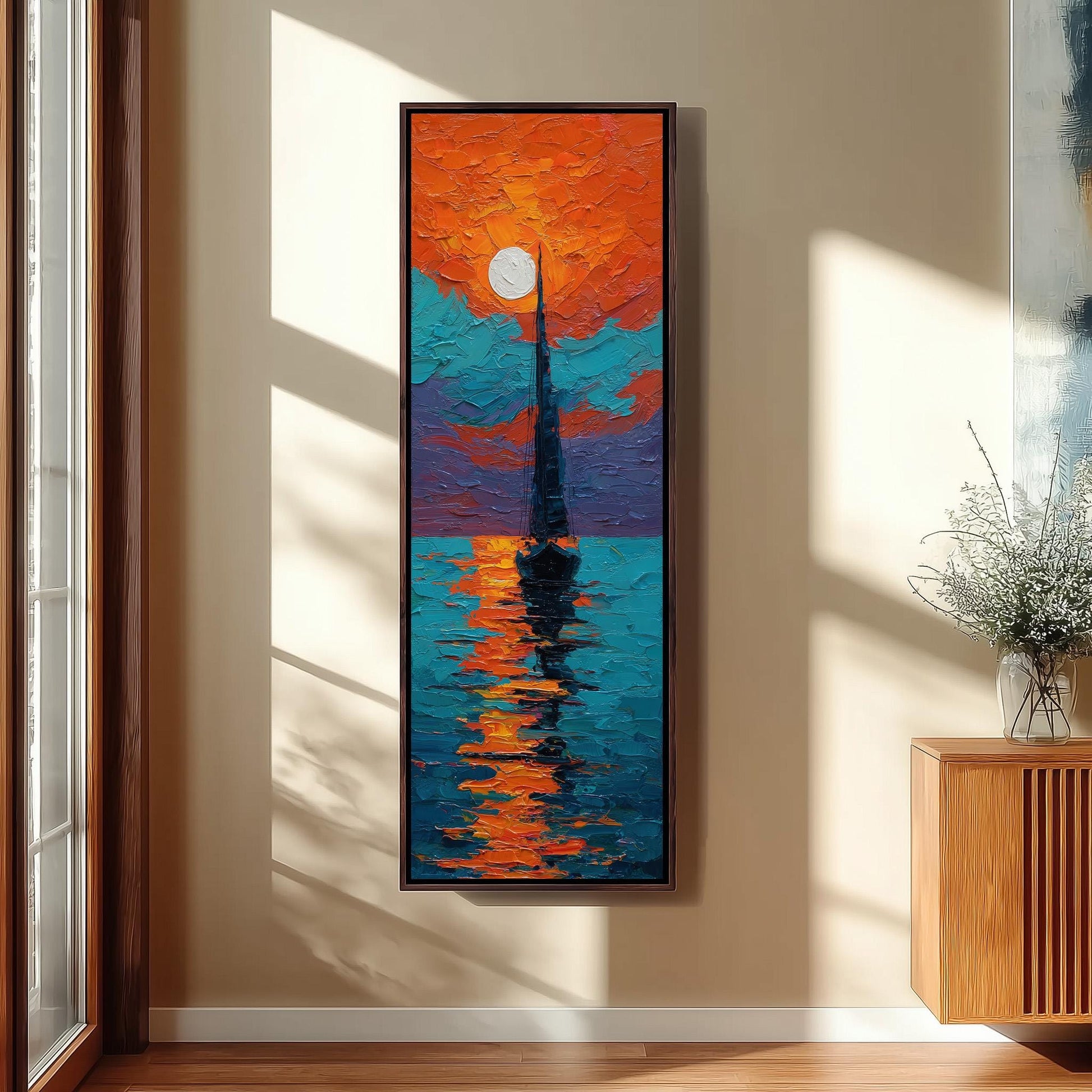 a large, colorful painting of a sailboat on the water, hanging on a wall in a room with a window.