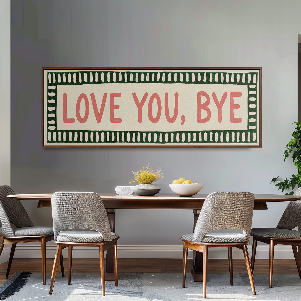Love you, bye sign with a green border long horizontal canvas print above a dining table