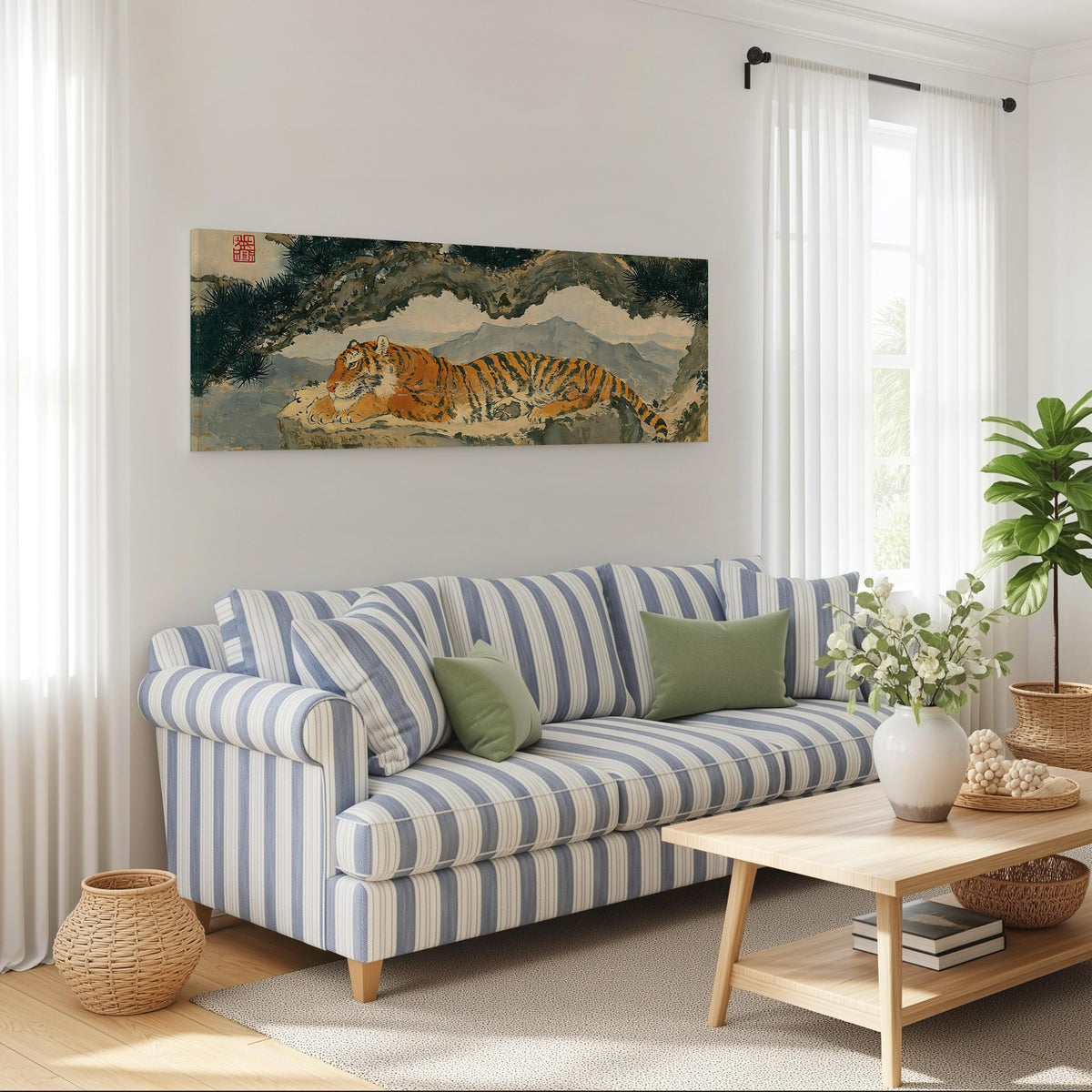 Tiger resting beneath misty pines long horizontal canvas print above a striped sofa in a coastal living room