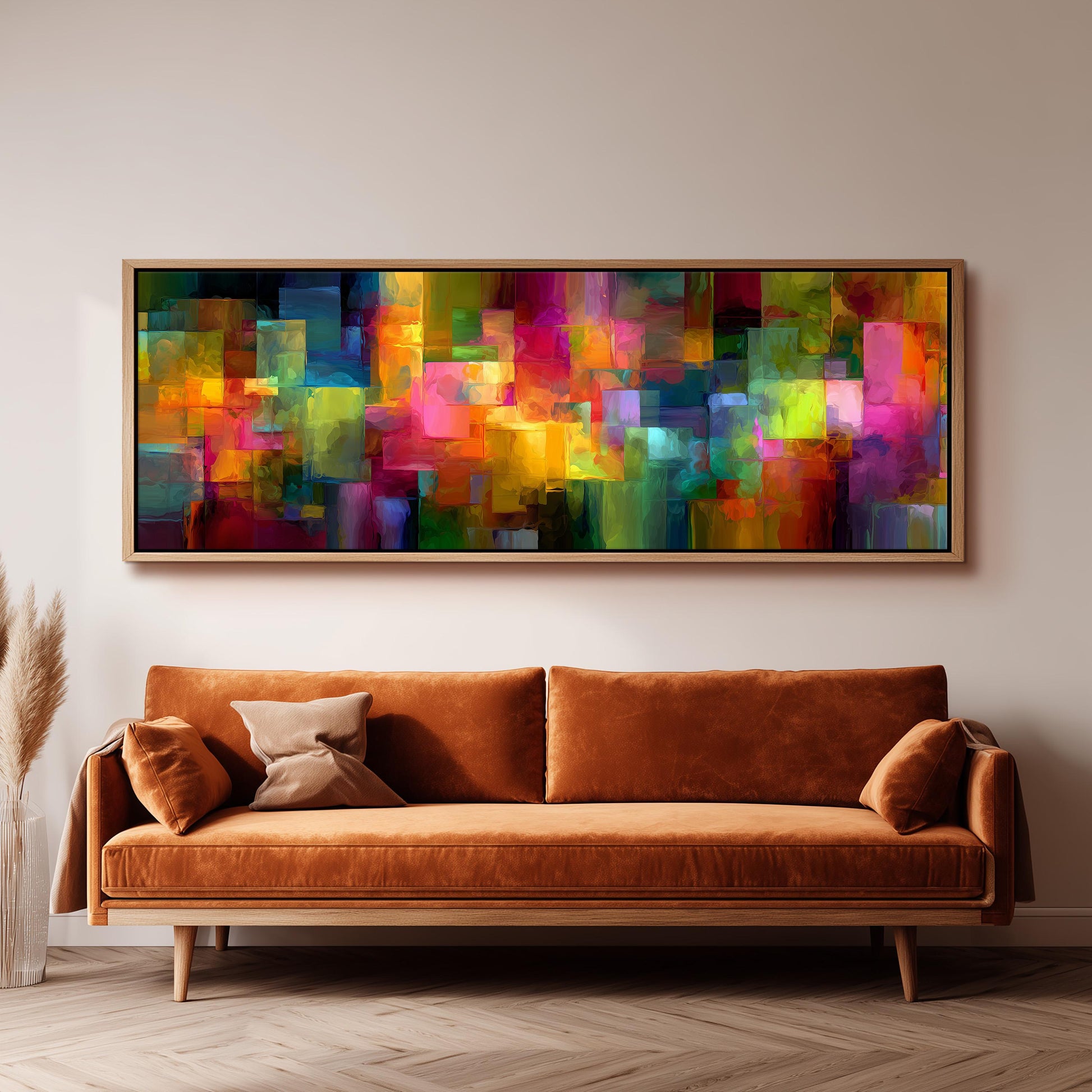 a large, vibrant abstract painting hanging on a wall above a brown sofa in a living room setting.
