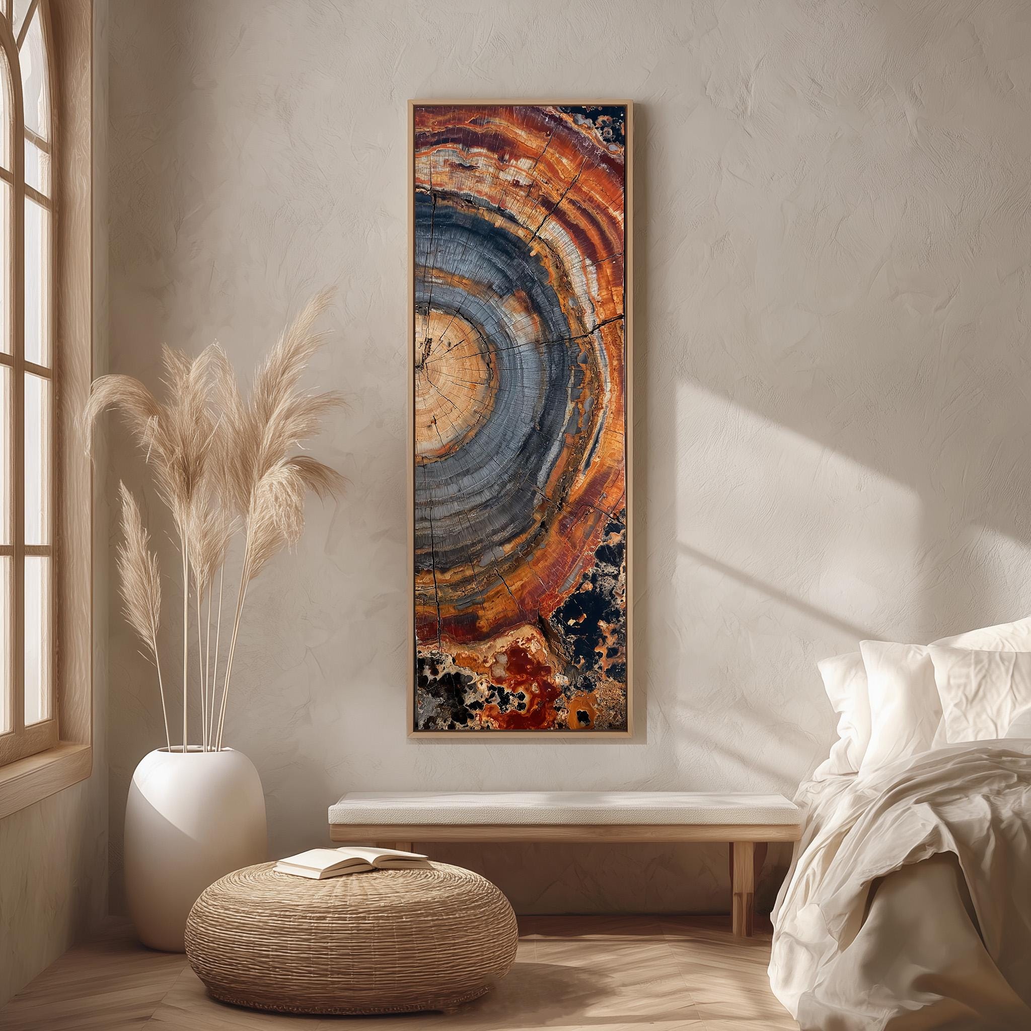 a large abstract painting hanging on a wall in a minimalist bedroom setting.