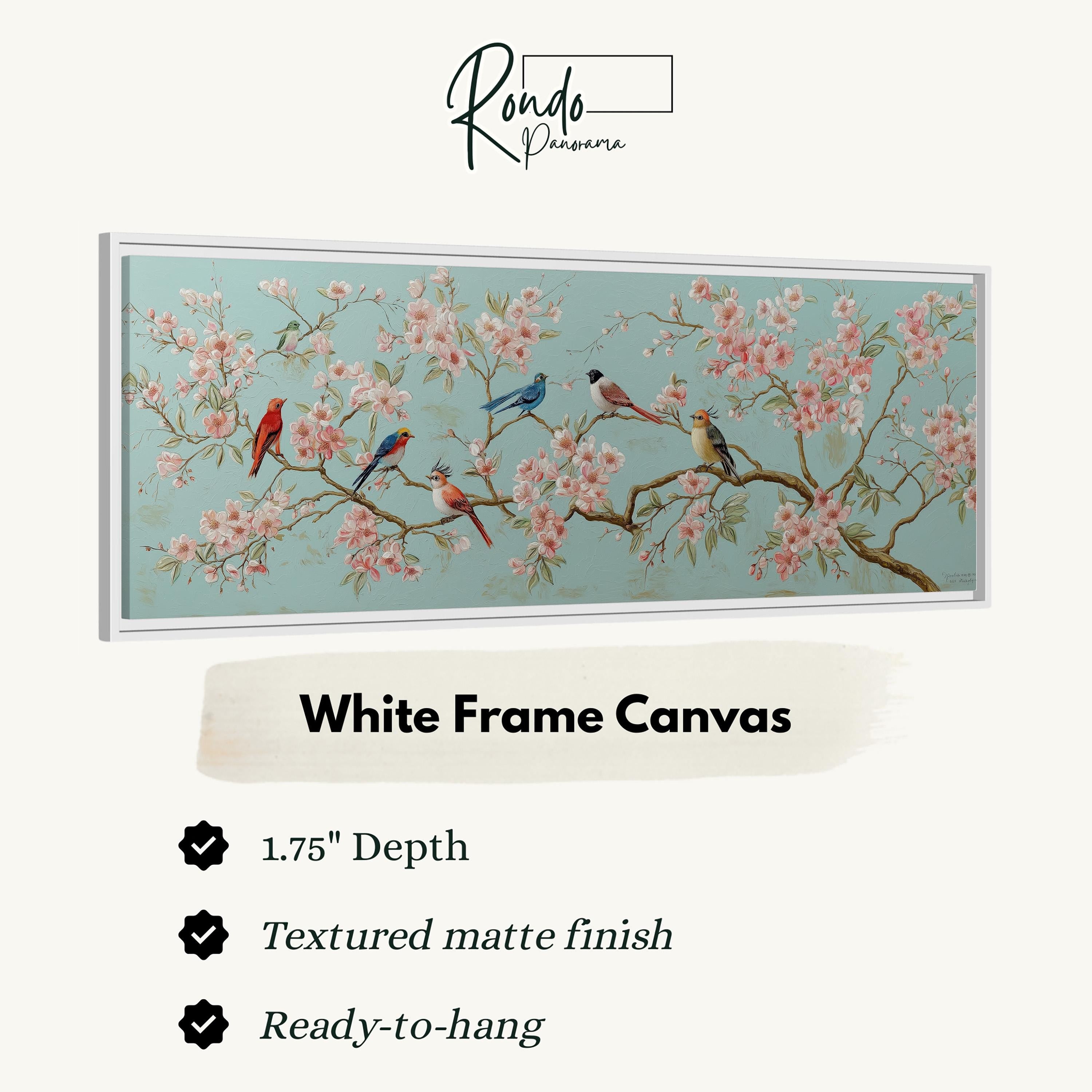 a white frame canvas with a painting of birds perched on branches with pink flowers. The frame has a 1.75" depth and is textured with a matte finish. It is ready to hang.
