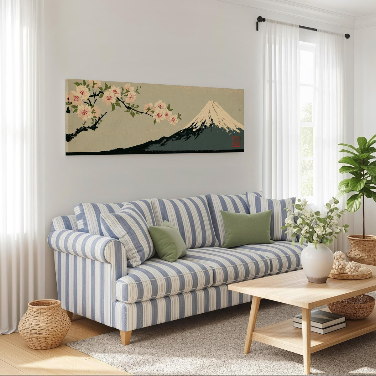Cherry blossom branch and Mount Fuji long horizontal canvas print above a striped sofa in a coastal living room