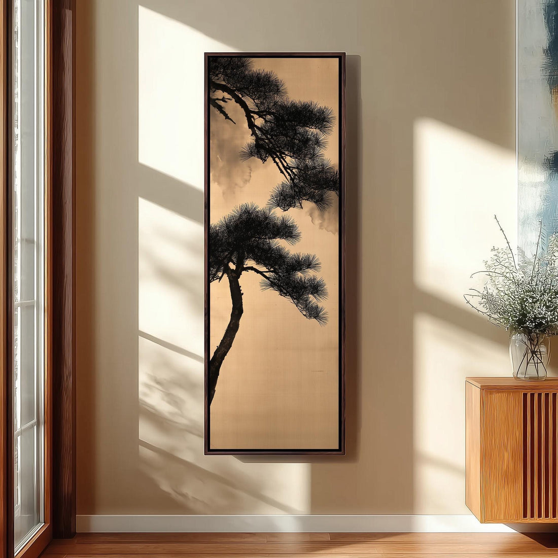 Pine branch silhouette on gold long vertical canvas print in a sunlit living space