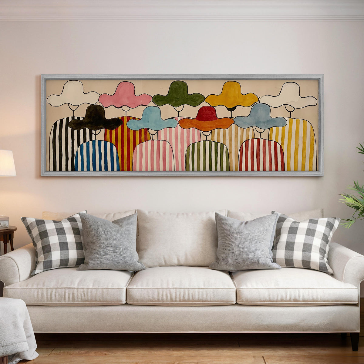 Gathering of figures in straw hats and stripes panoramic canvas print above a white sofa in a bright living room