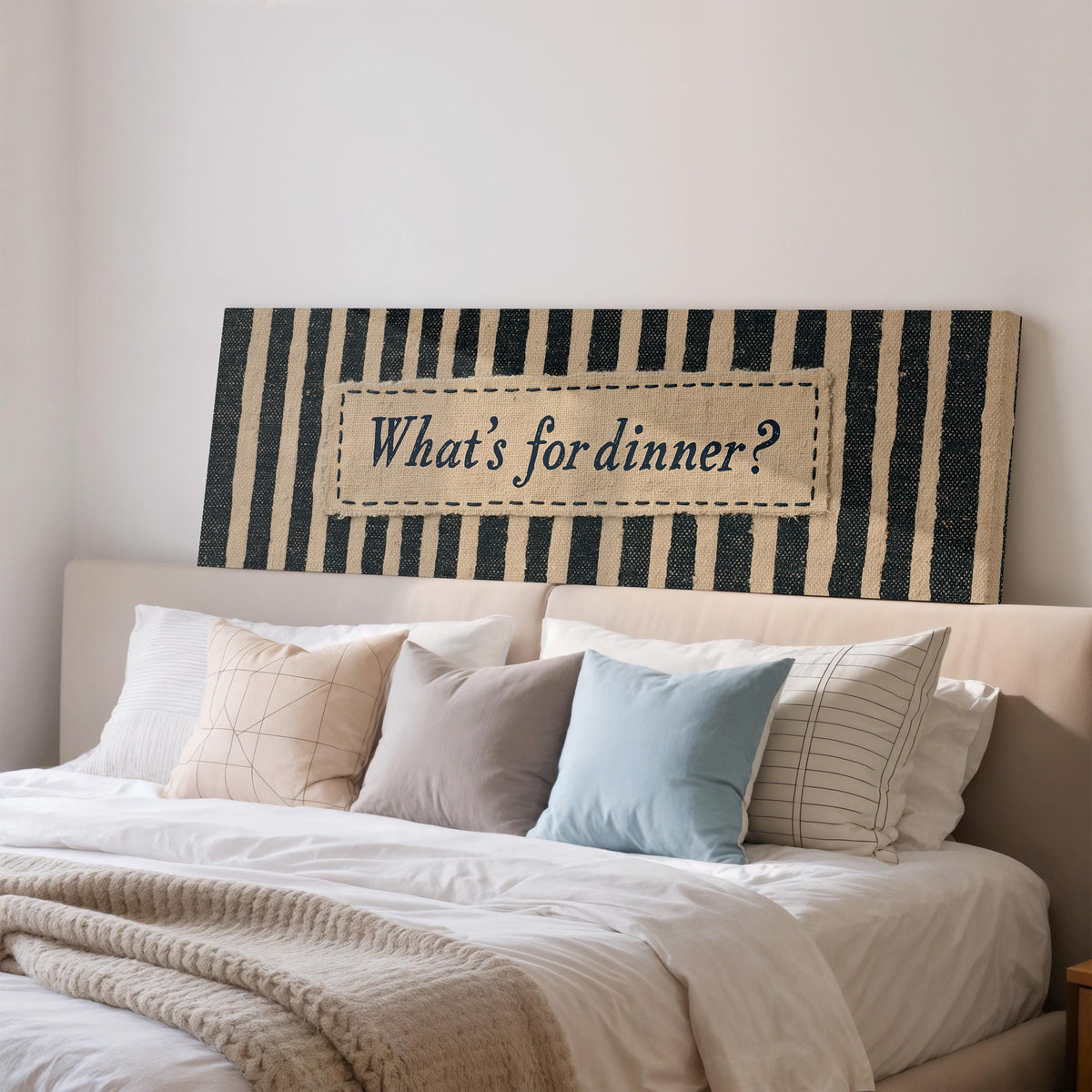 What's for dinner sign on black stripes wide panoramic canvas print above a bed in a bedroom