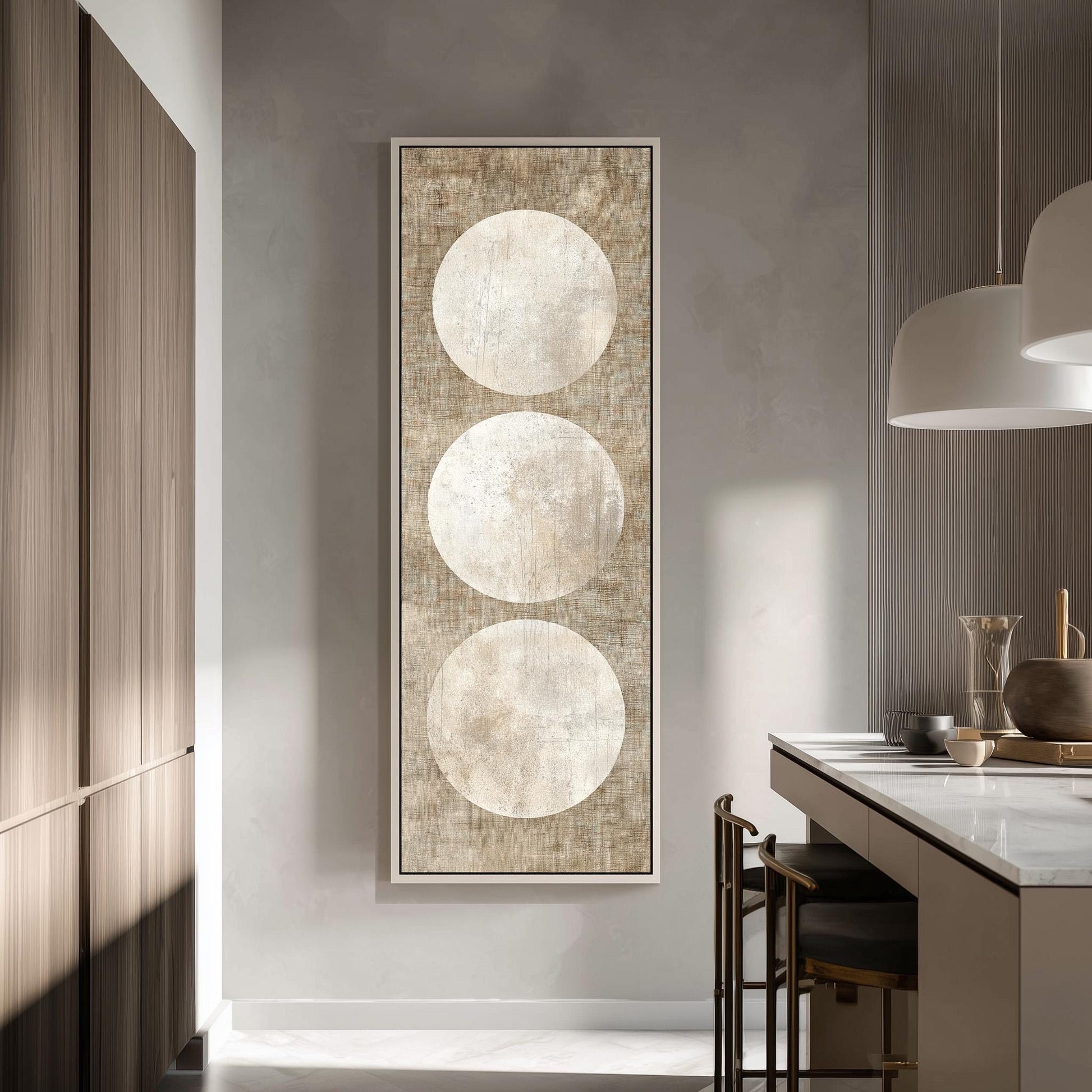 a modern kitchen with a large abstract painting hanging on the wall, depicting three circles in a minimalist design.
