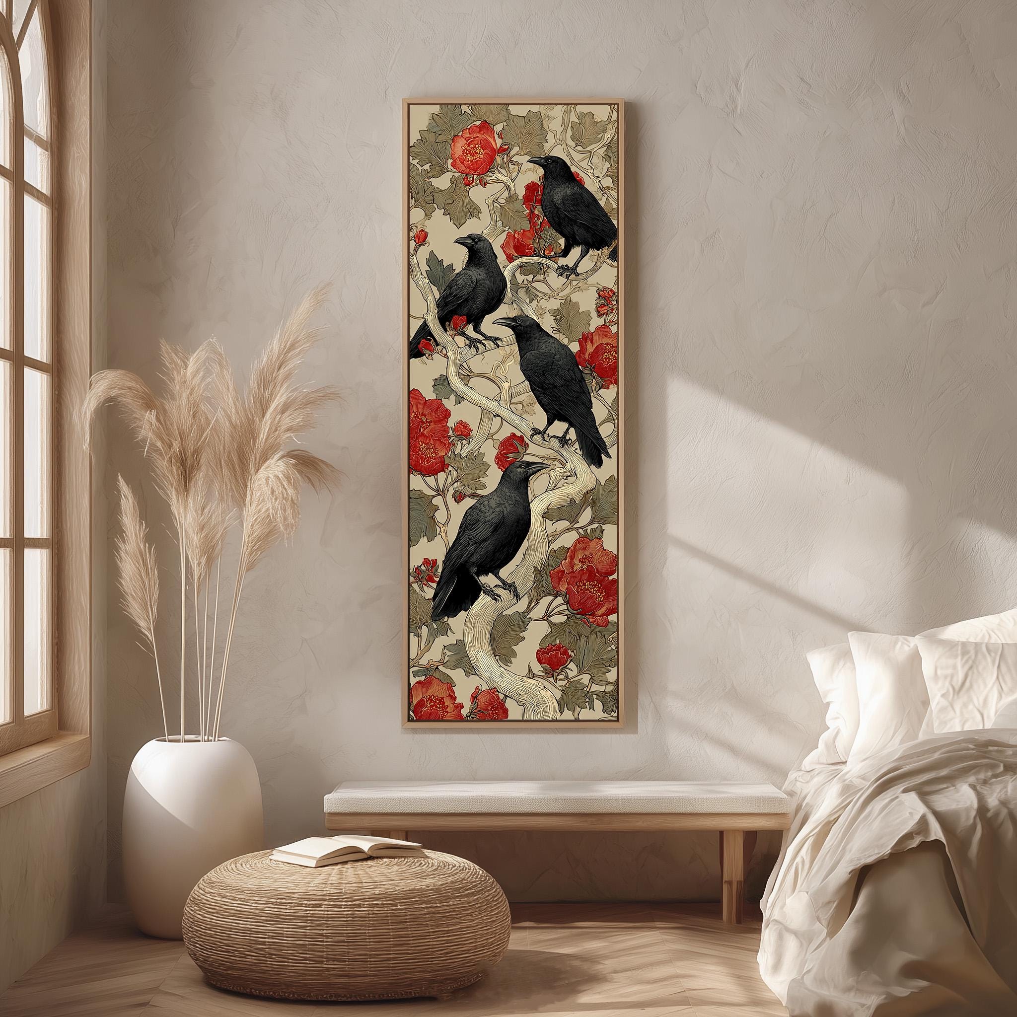 a large framed artwork of black crows perched on branches with red flowers, hanging on a wall in a minimalist living room setting.
