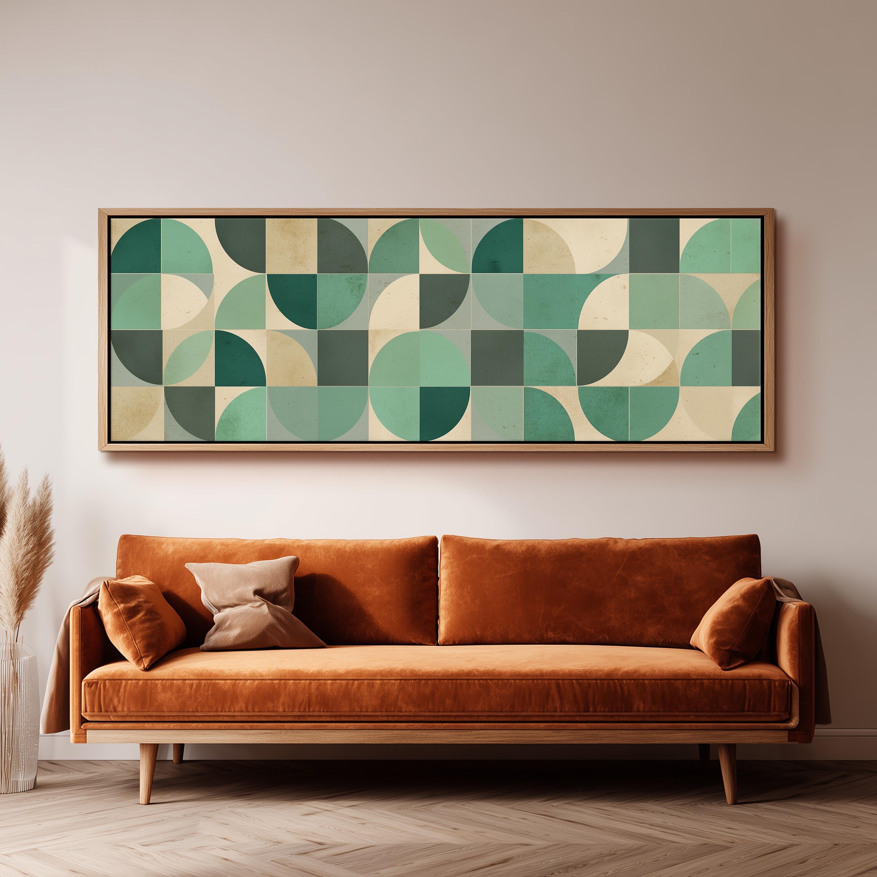 a large, rectangular abstract artwork hanging on a wall above a brown sofa with orange cushions.