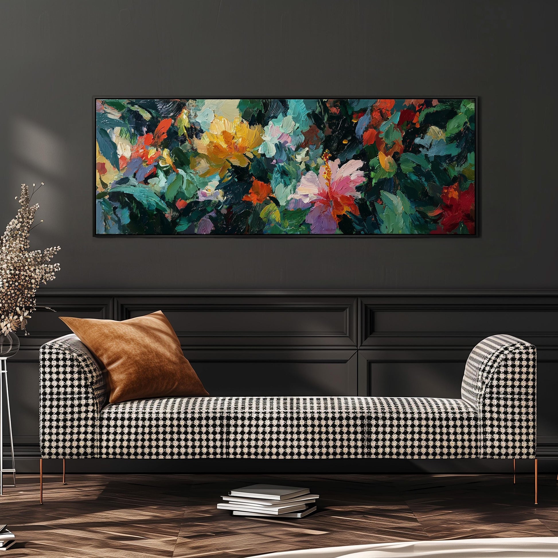 a large, colorful painting of flowers hanging on a wall above a black and white checkered sofa in a living room setting.
