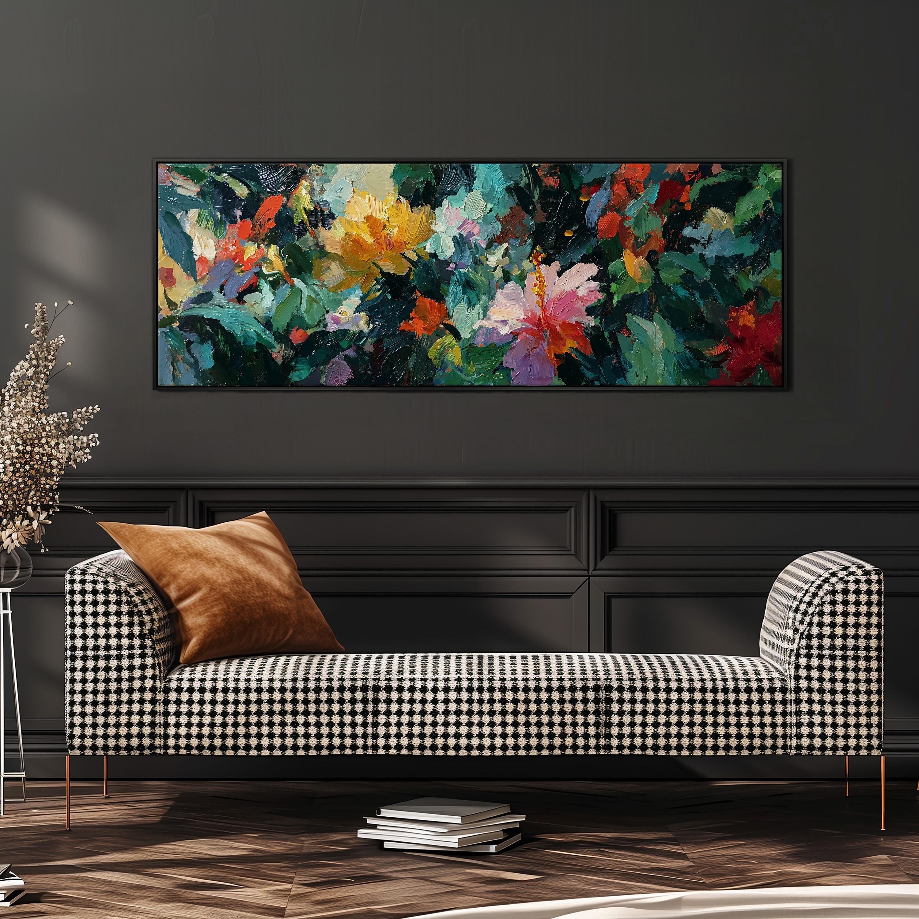 a large, colorful painting of flowers hanging on a wall above a black and white checkered sofa in a living room setting.