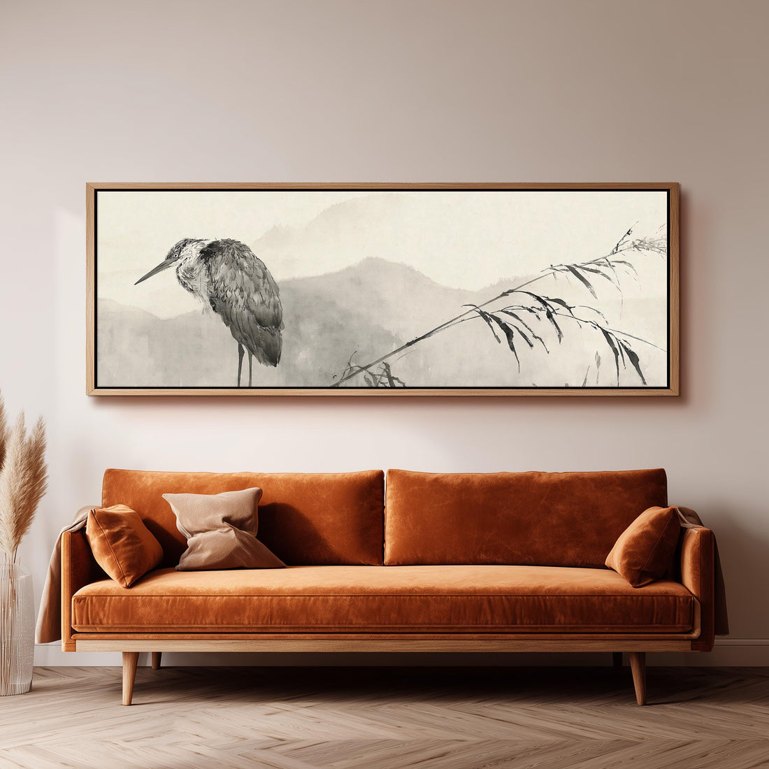 Heron in front of misty ink mountains long horizontal canvas print above a sofa in a living room