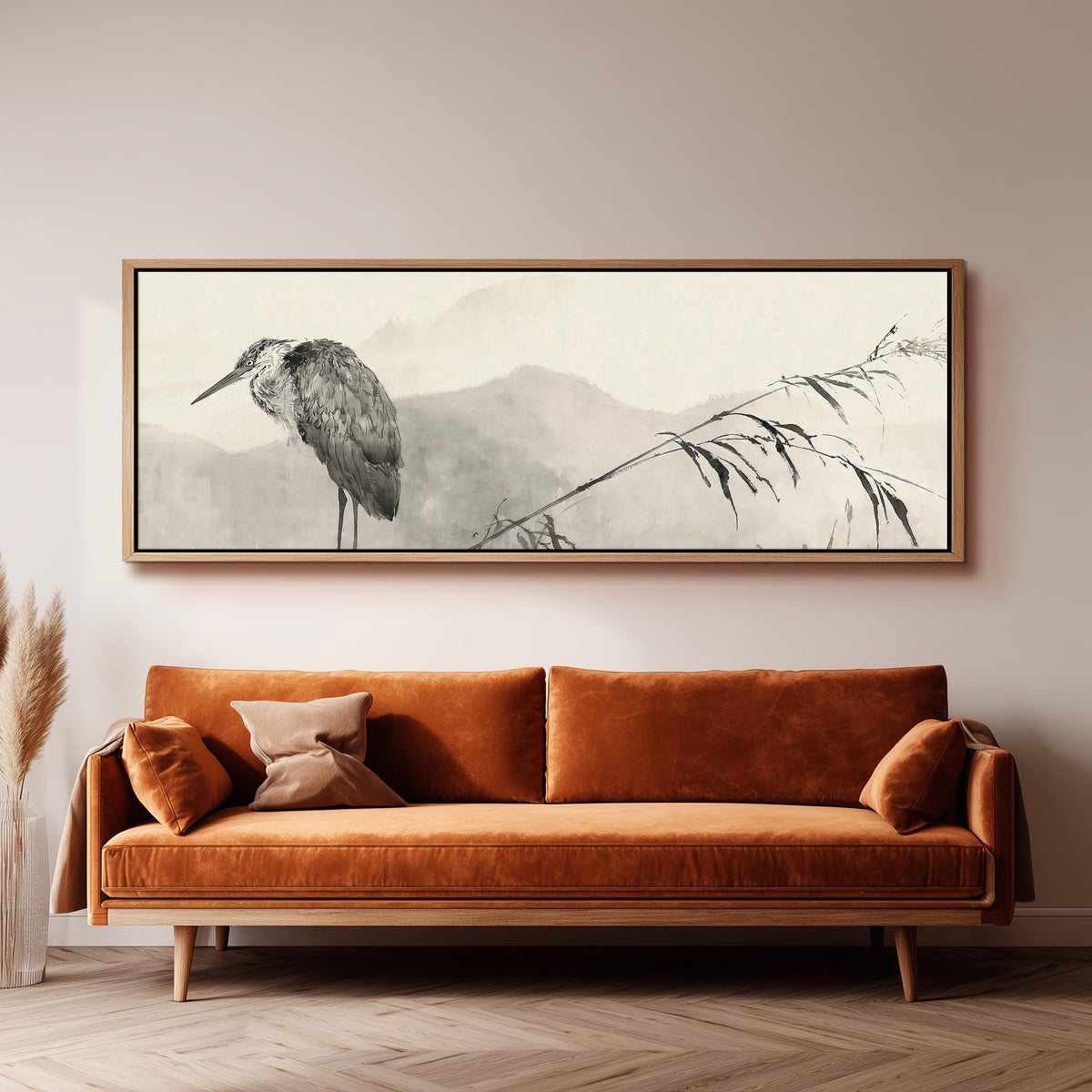Heron in front of misty ink mountains panoramic canvas print above a sofa in a living room