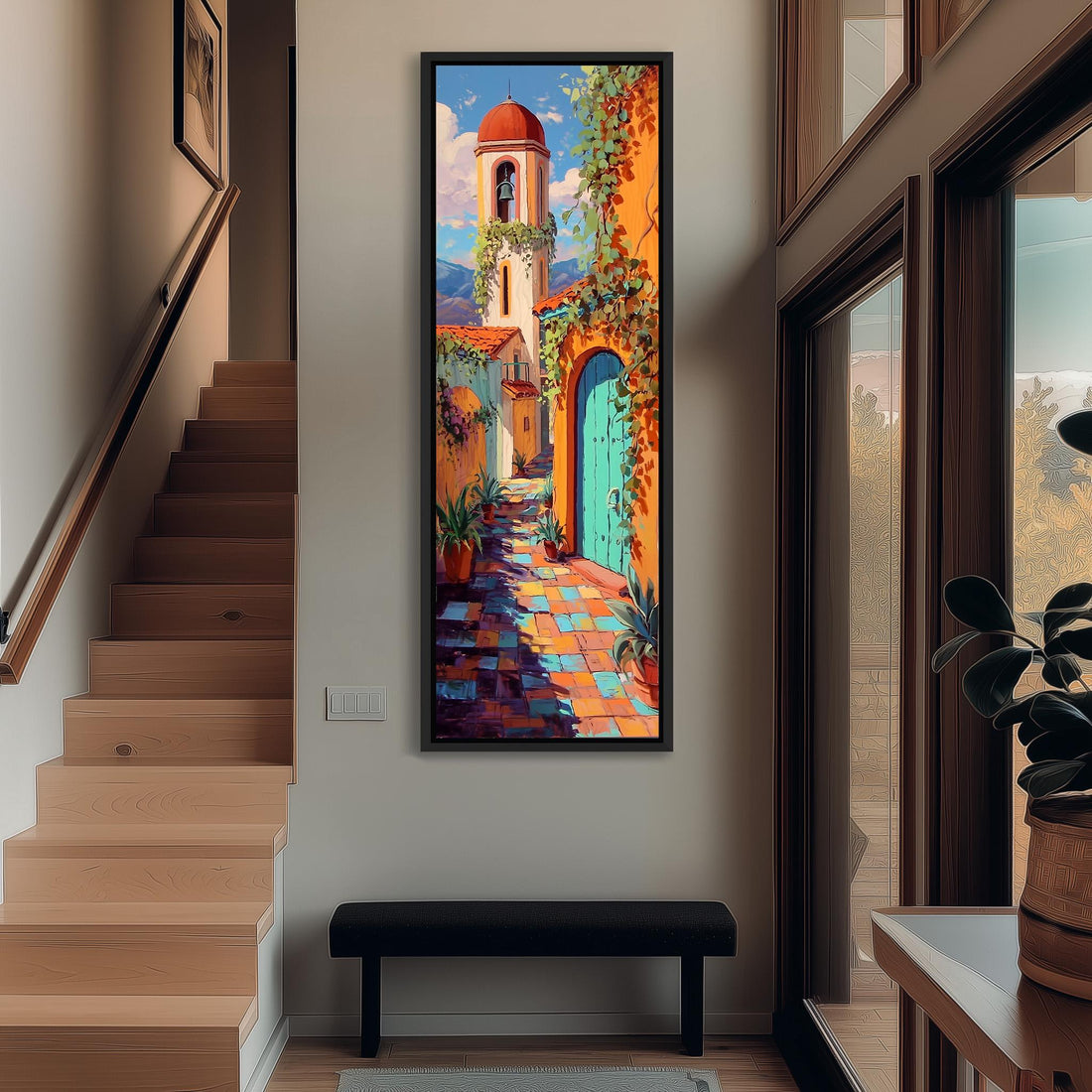 a large, colorful painting of a Spanish-style building with a bell tower, hanging on a wall in a room with a wooden floor and a window.