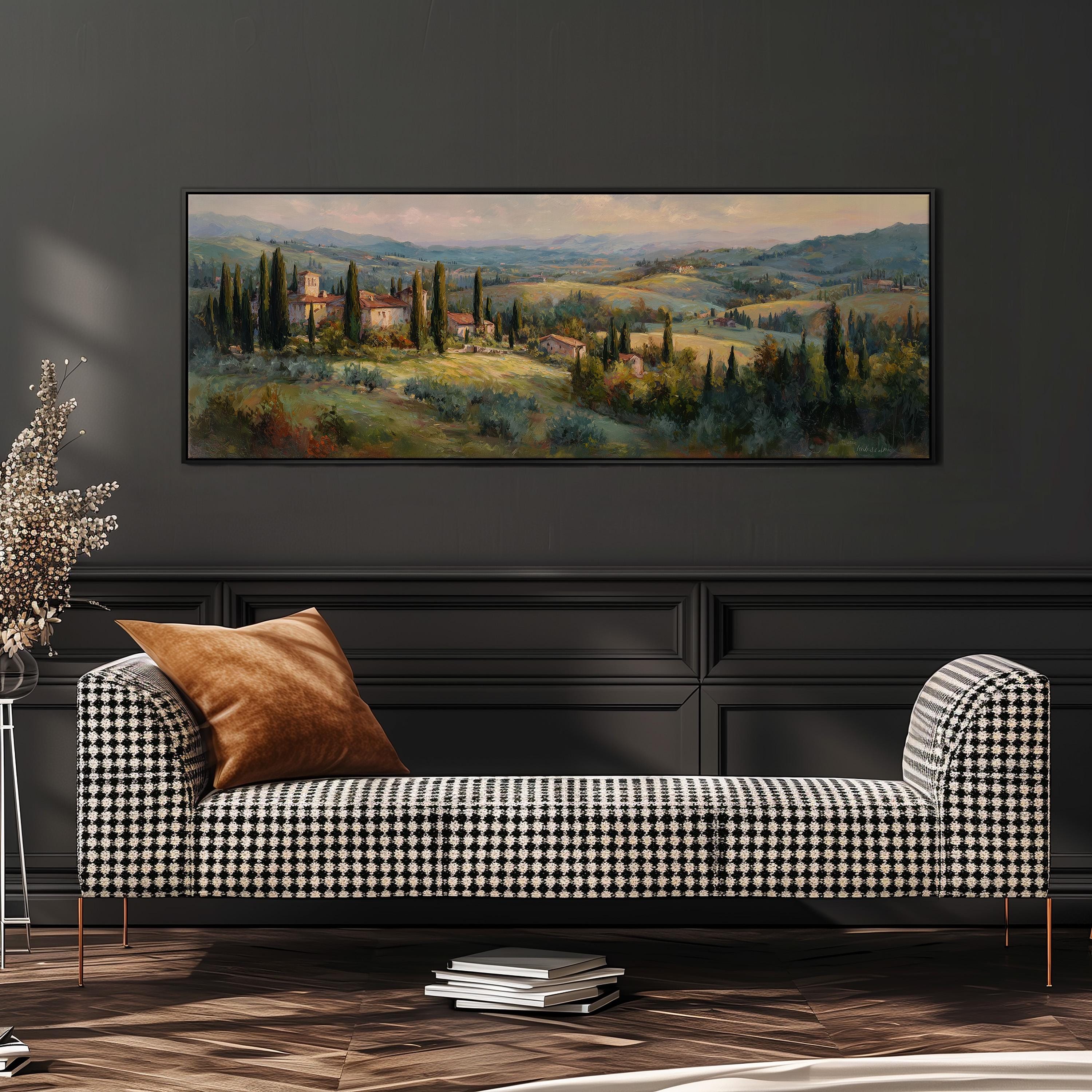 a large painting of a countryside landscape hanging on a wall above a black and white checkered sofa with a brown throw pillow.