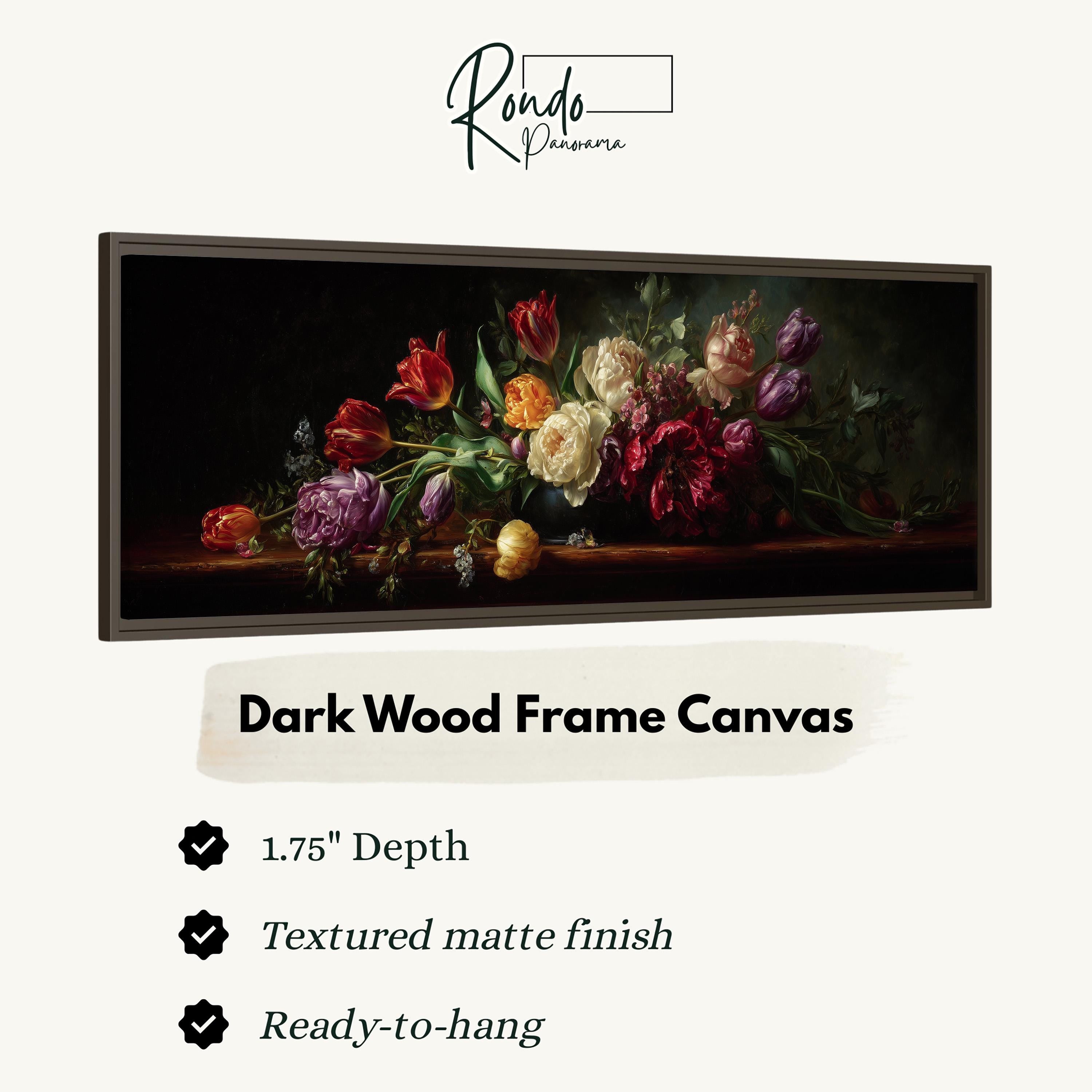 The image is a framed canvas depicting a still life of a bouquet of colorful flowers, including roses, peonies, and other blooms, arranged on a dark wood frame.