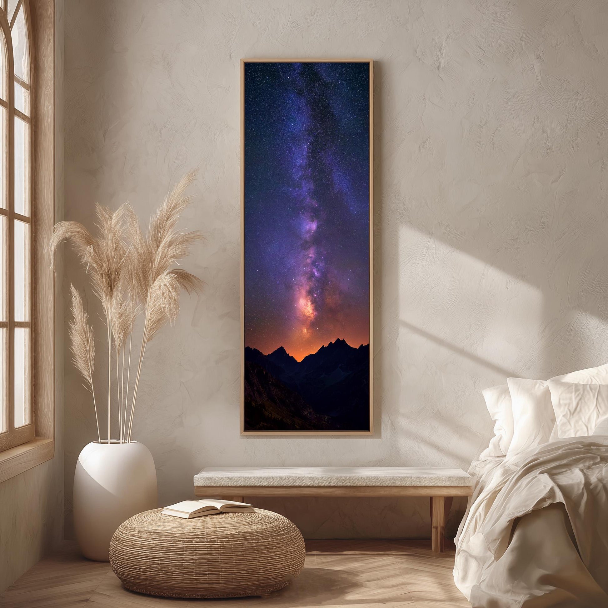 a large framed picture of a night sky with a galaxy, hanging on a wall in a bedroom setting.