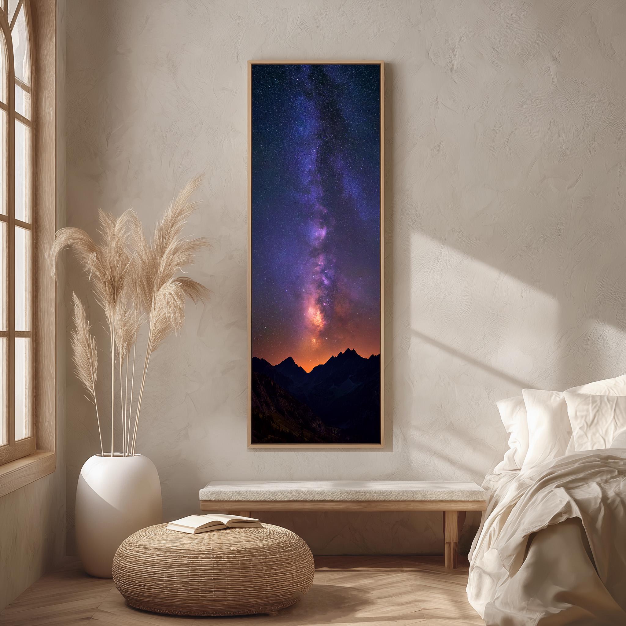 a large framed picture of a night sky with a galaxy, hanging on a wall in a bedroom setting.
