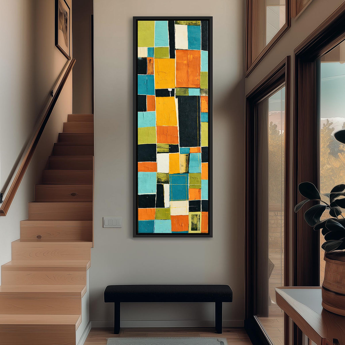 Bold mustard and teal patchwork blocks tall narrow canvas print beside a staircase in an entryway