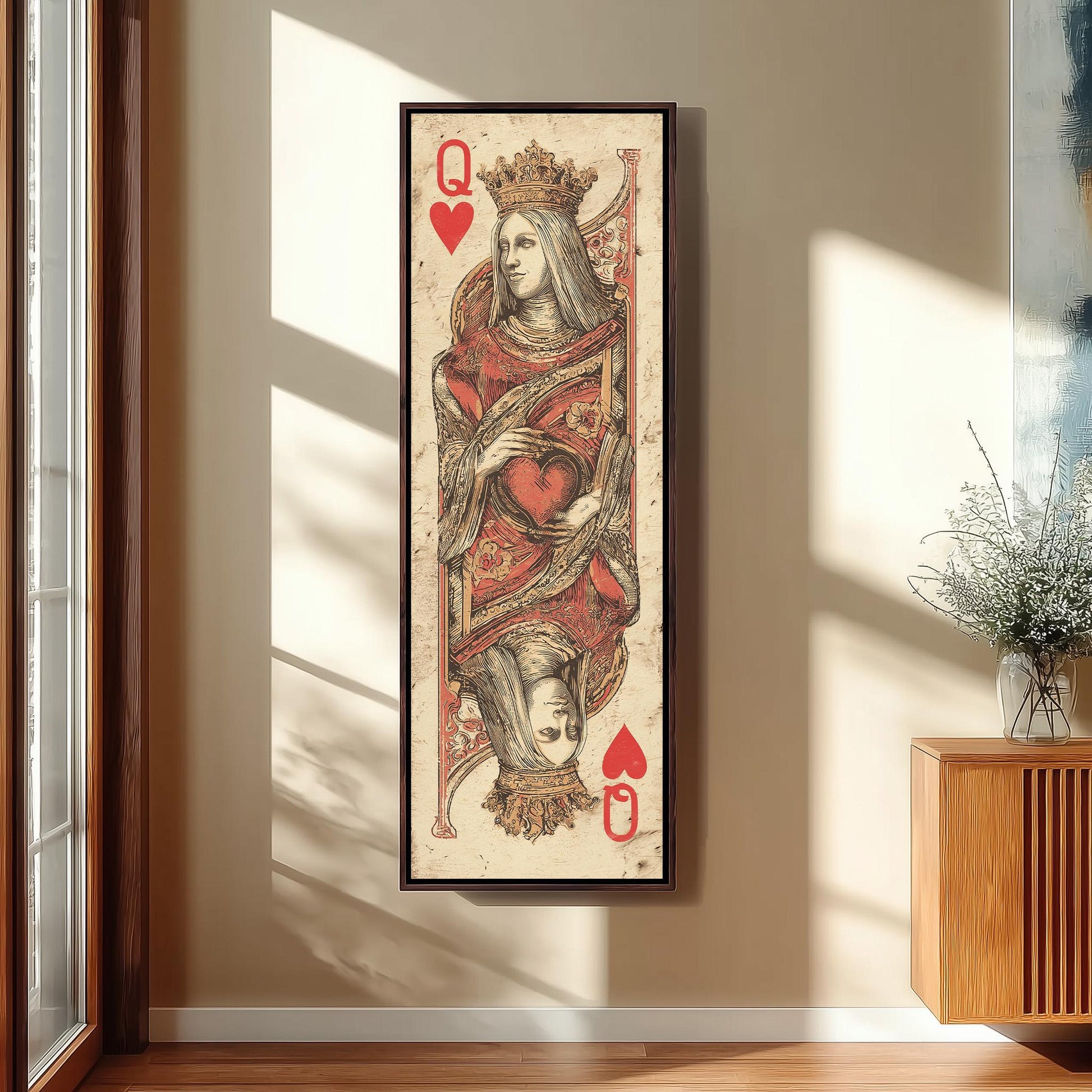 a large framed painting of a queen of spades playing card, with a red heart and a crown on her head.