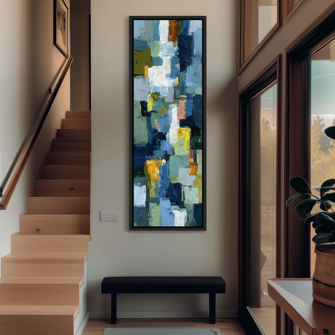 a large abstract painting hanging on a wall in a room with a wooden floor and a window.