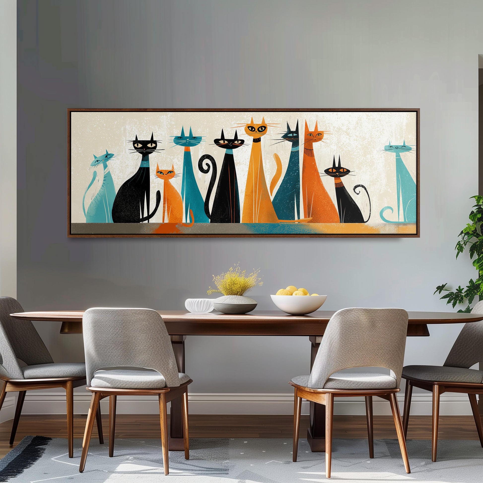 a modern dining room with a large framed artwork of cats on the wall above a wooden dining table with four chairs.