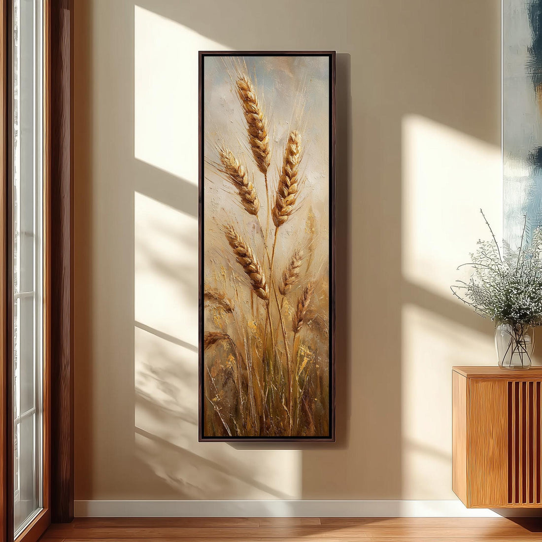 a serene and cozy bedroom scene, featuring a large painting of wheat stalks hanging on the wall, a white bed with a white pillow, a white vase with tall potted plants, and a woven ottoman in front of the bed.