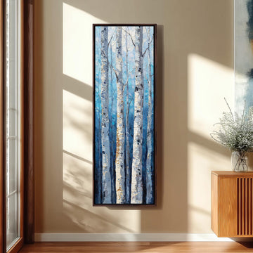 a large painting of birch trees with white bark, hanging on a wall in a room with a wooden cabinet and a vase of flowers.