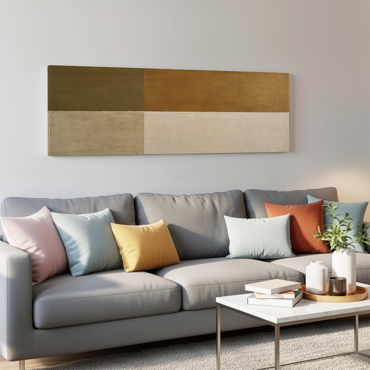 Olive and cream quadrants panoramic canvas print above a grey sofa in a living room
