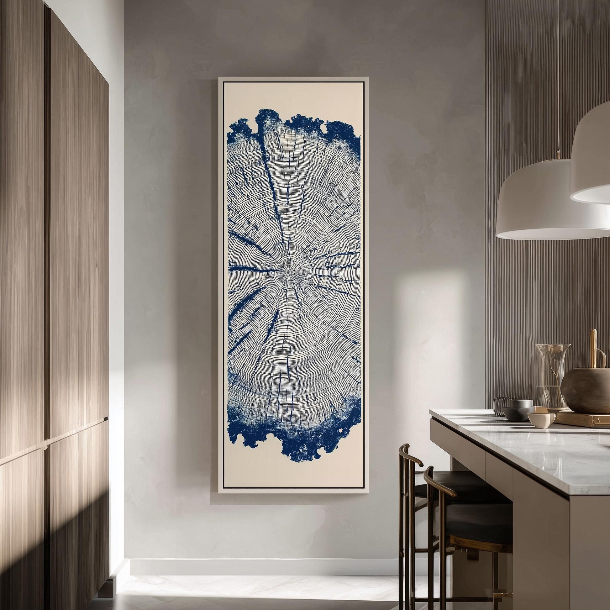 a large framed artwork depicting a tree stump with a blue and white color scheme, hanging on a wall in a modern kitchen setting.