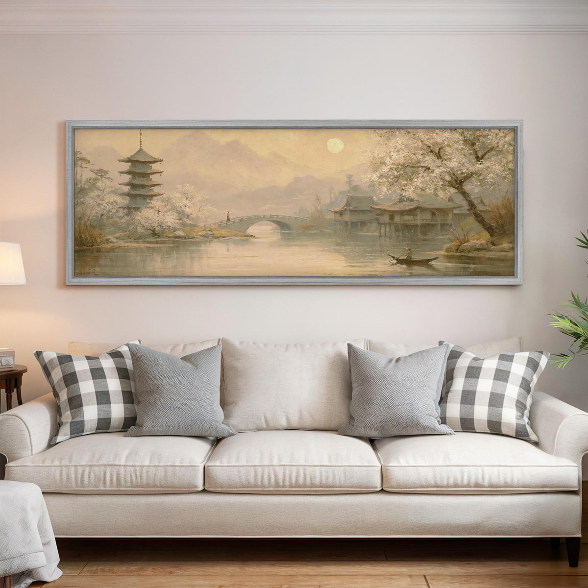 Pagoda and stone bridge at dusk panoramic canvas print above a white sofa in a bright living room