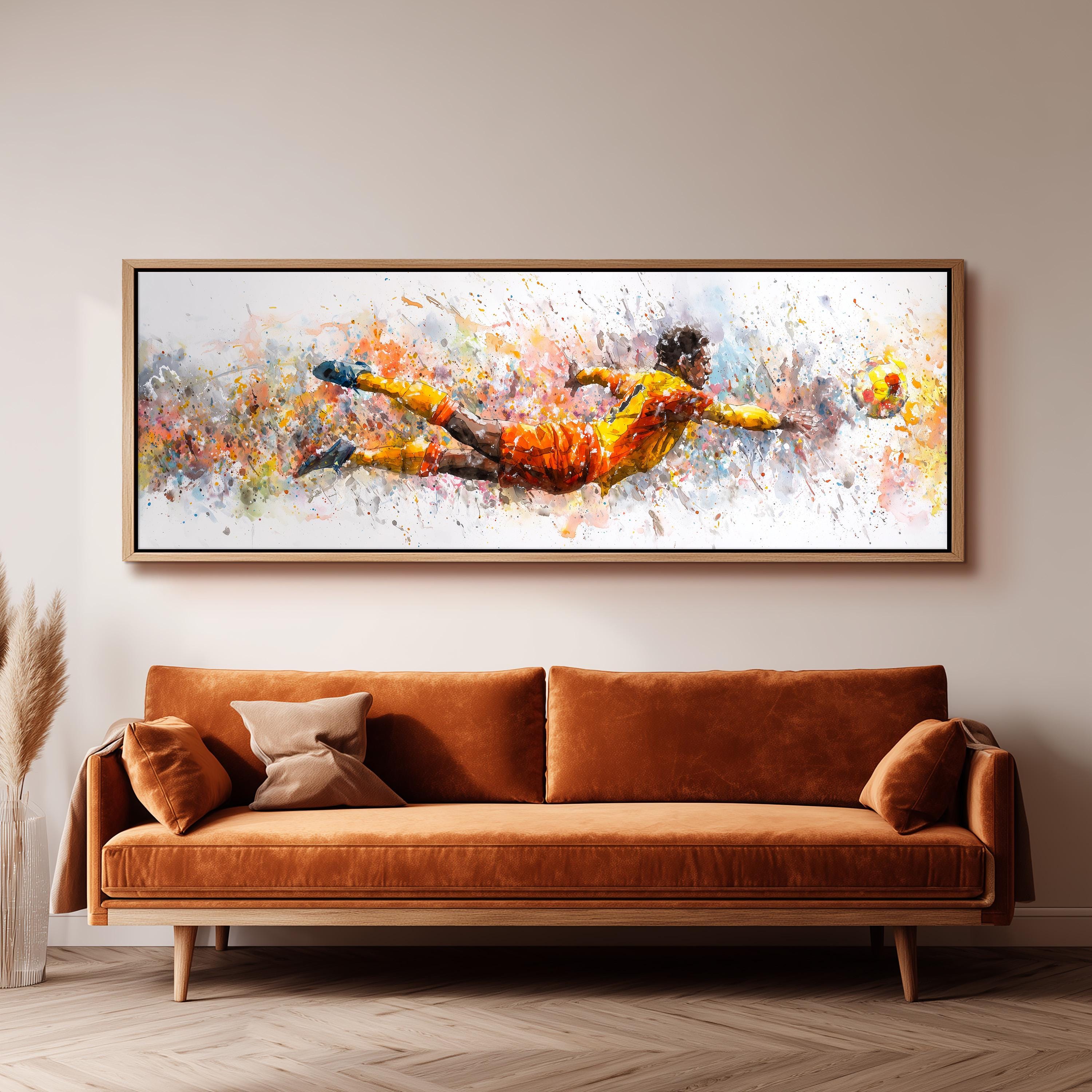 a large, colorful painting of a soccer player in mid-air, with splashes of color and dynamic brushstrokes. The painting is hung on a wall above a brown sofa, creating a striking visual focal point in the room.