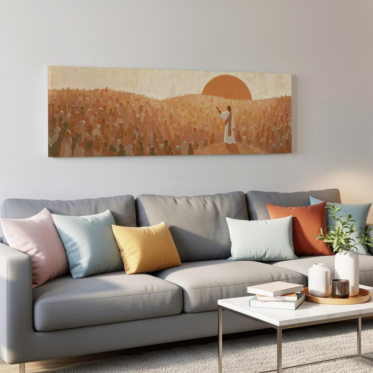 Jesus preaching to a crowd at sunset panoramic canvas print above a grey sofa in a living room