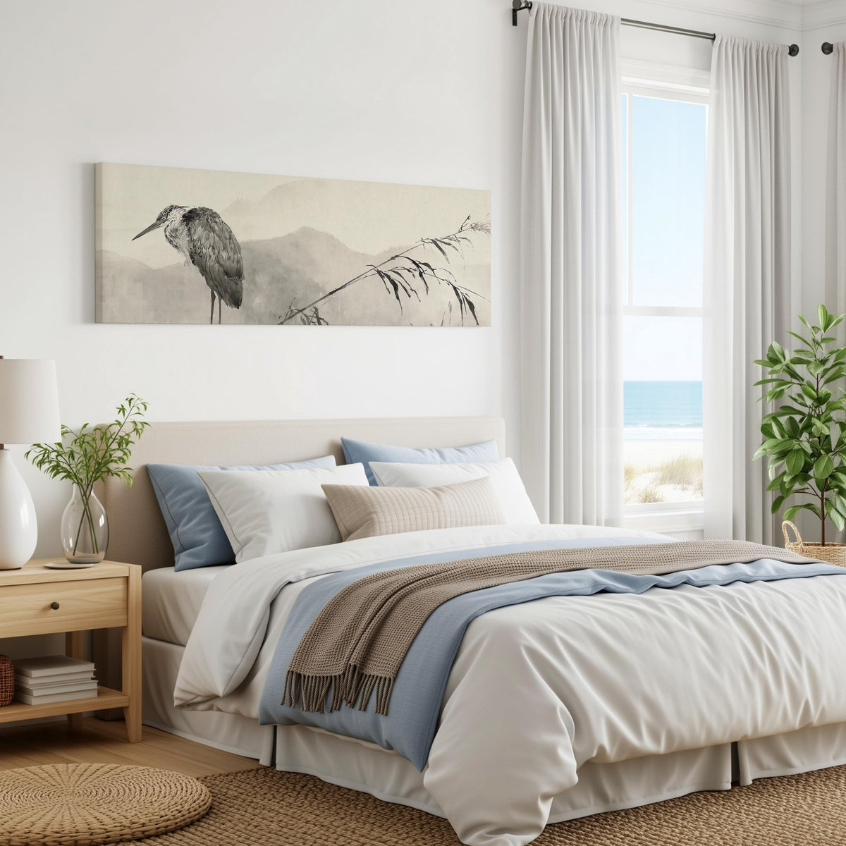 Heron in front of misty ink mountains panoramic canvas print above a bed in a coastal bedroom