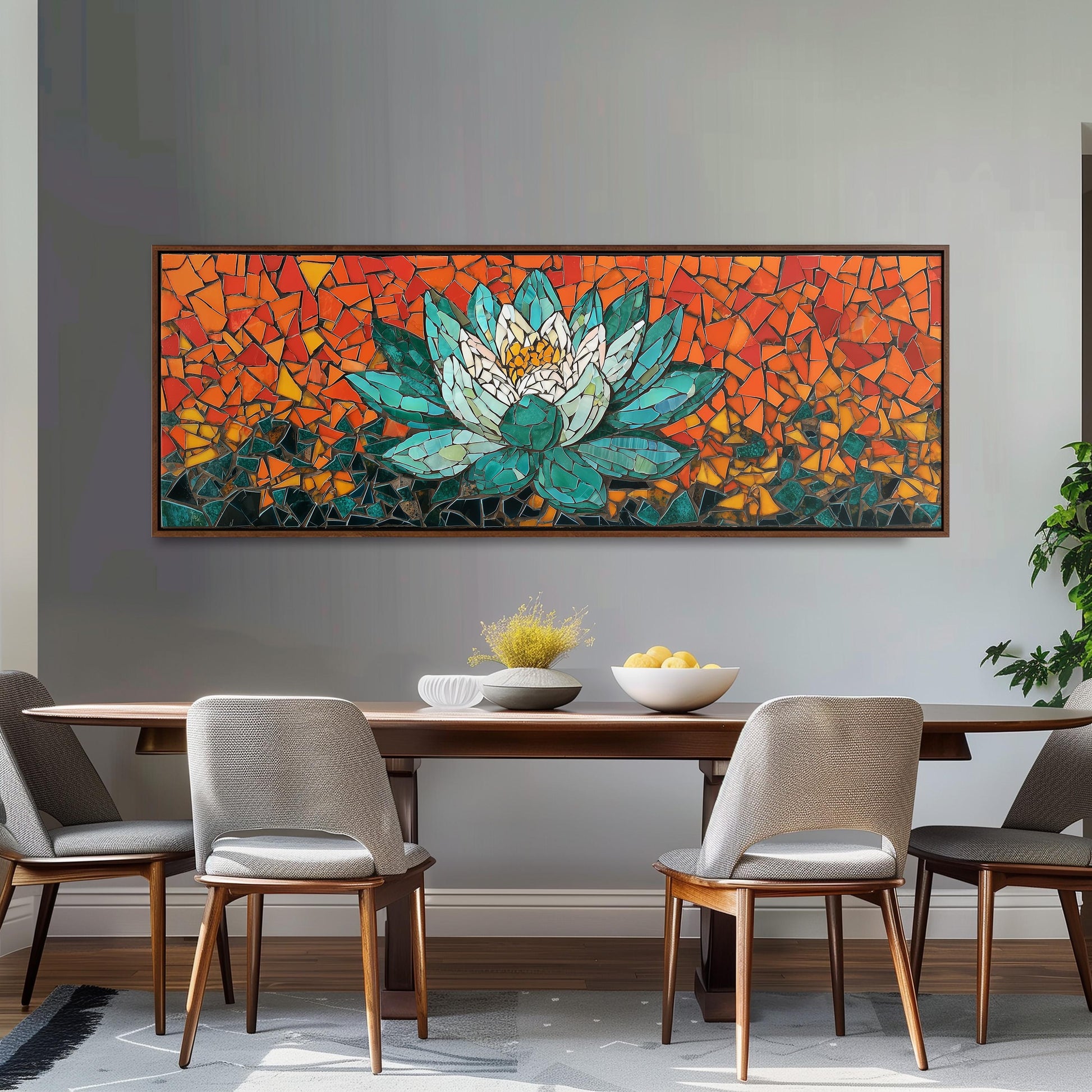 a dining room with a large, colorful mosaic artwork depicting a lotus flower on the wall above a wooden dining table. The table is set with a bowl of fruit and a vase of flowers, creating a warm and inviting atmosphere.