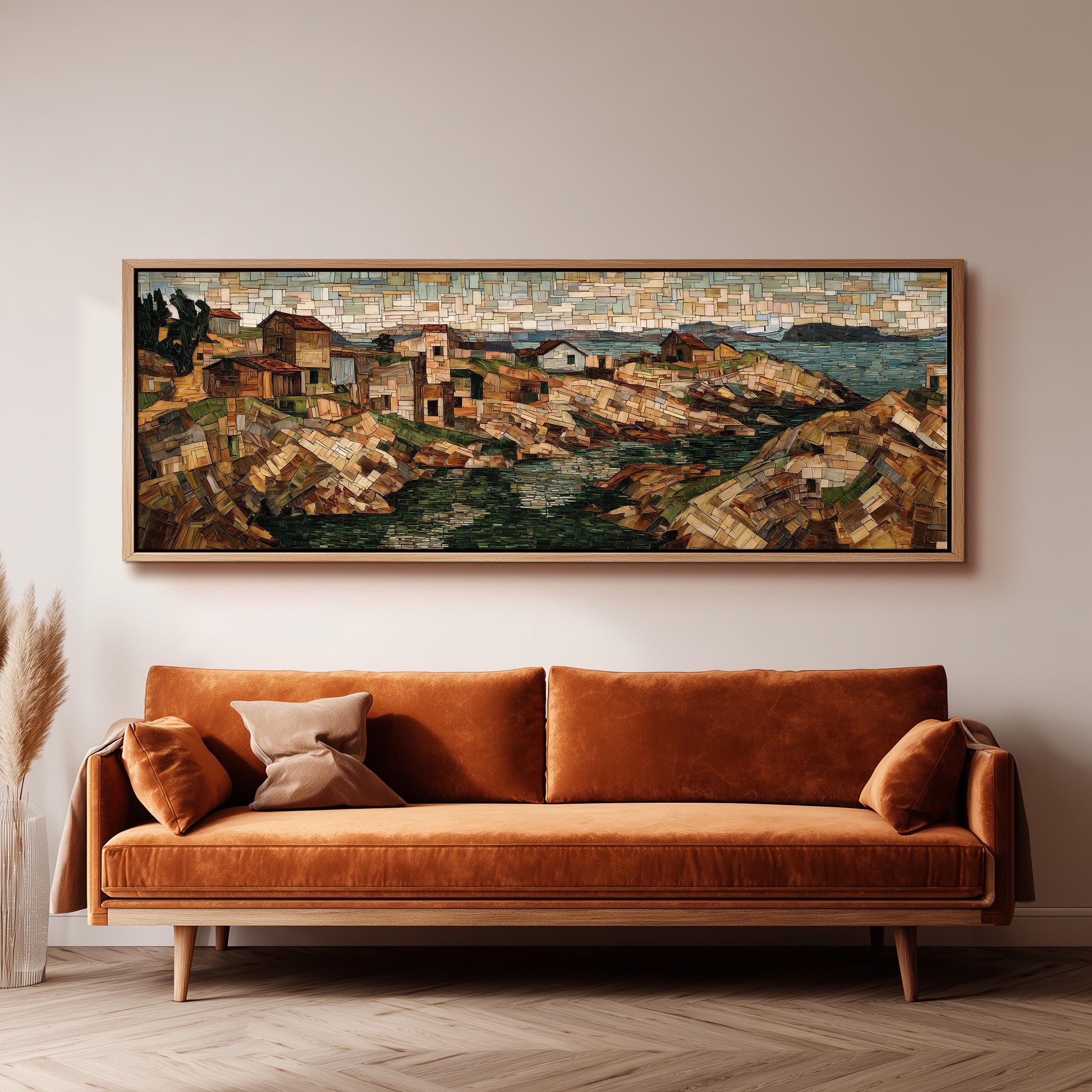 a large, colorful painting of a coastal town hanging on a wall above a brown sofa.