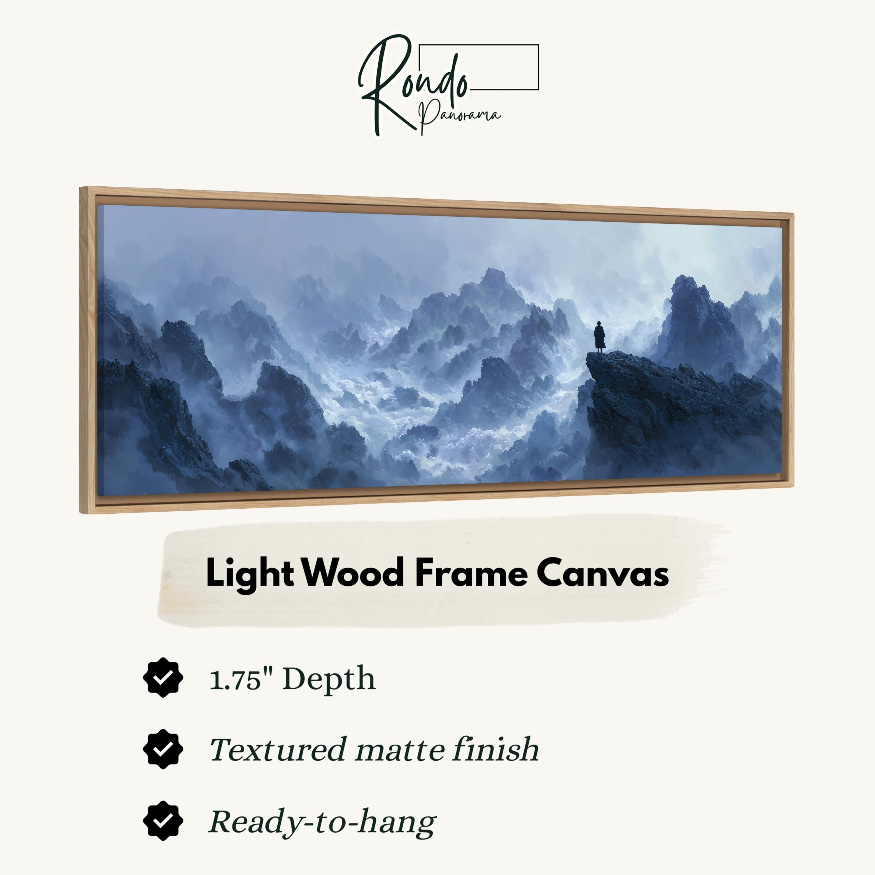 The image is a framed artwork depicting a person standing on a cliff overlooking a misty, mountainous landscape.