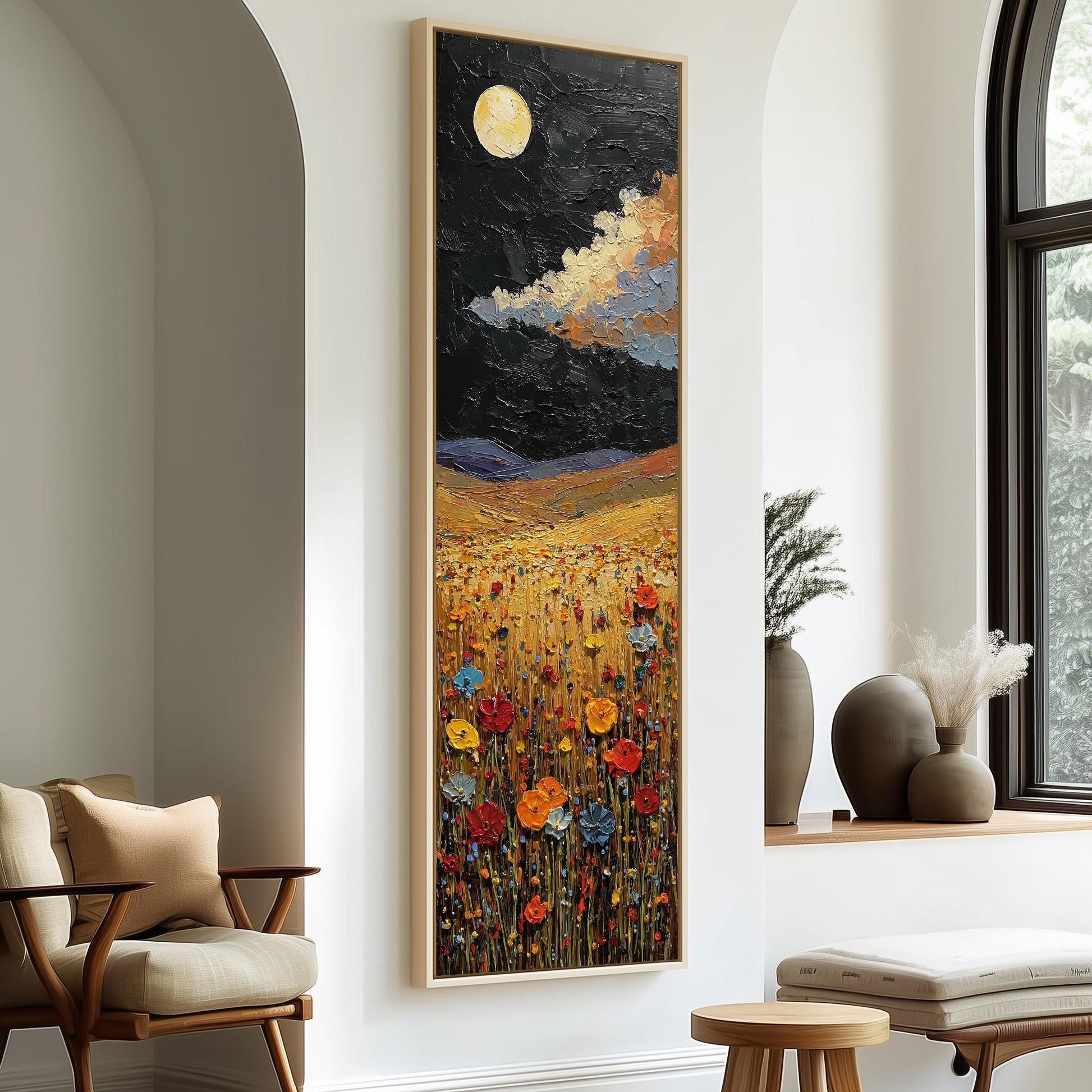 a large painting of a field with flowers hanging on a wall, accompanied by a wooden chair and a small table in the foreground.