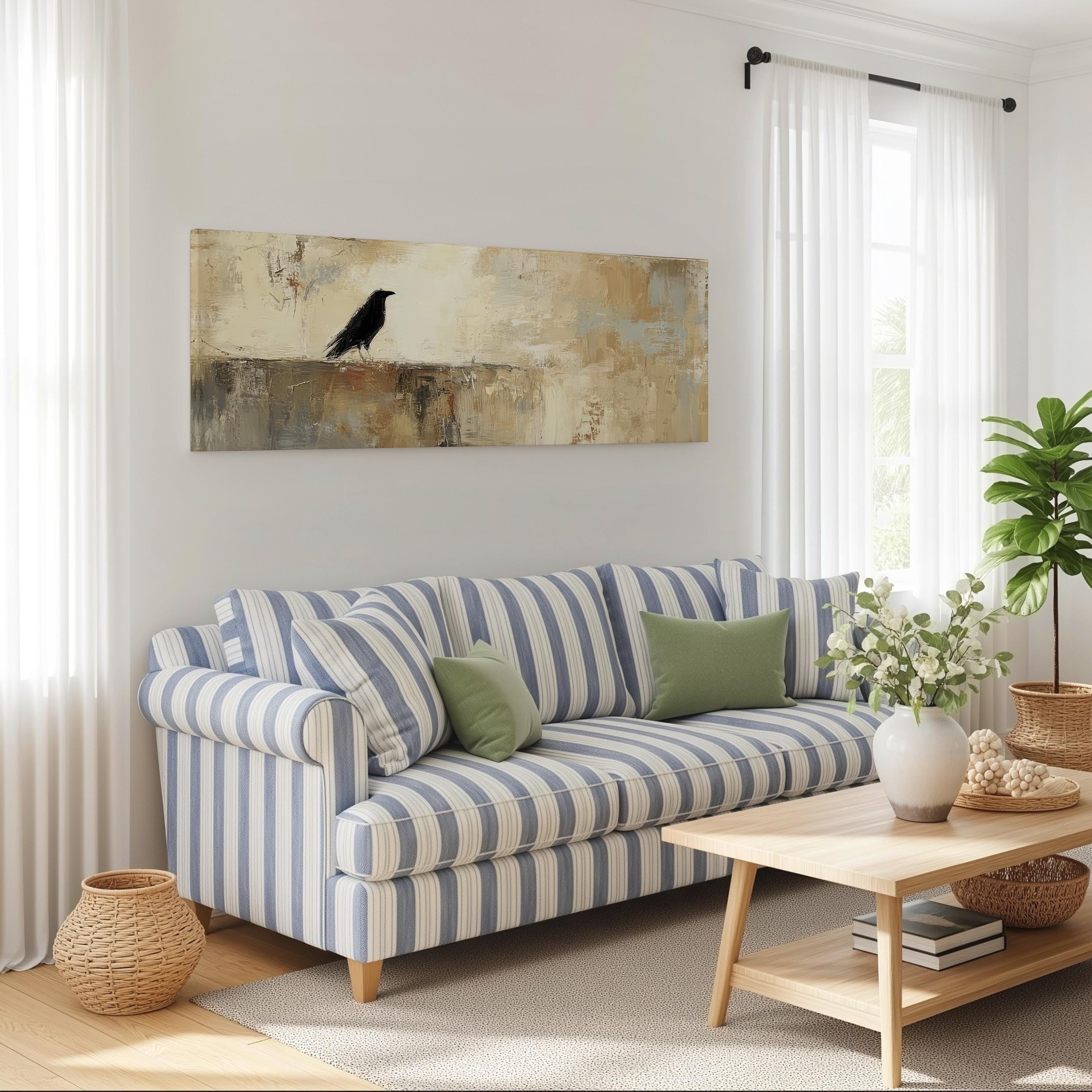 a cozy living room with a striped blue and white sofa, a wooden coffee table, and a large painting of a black bird on the wall.
