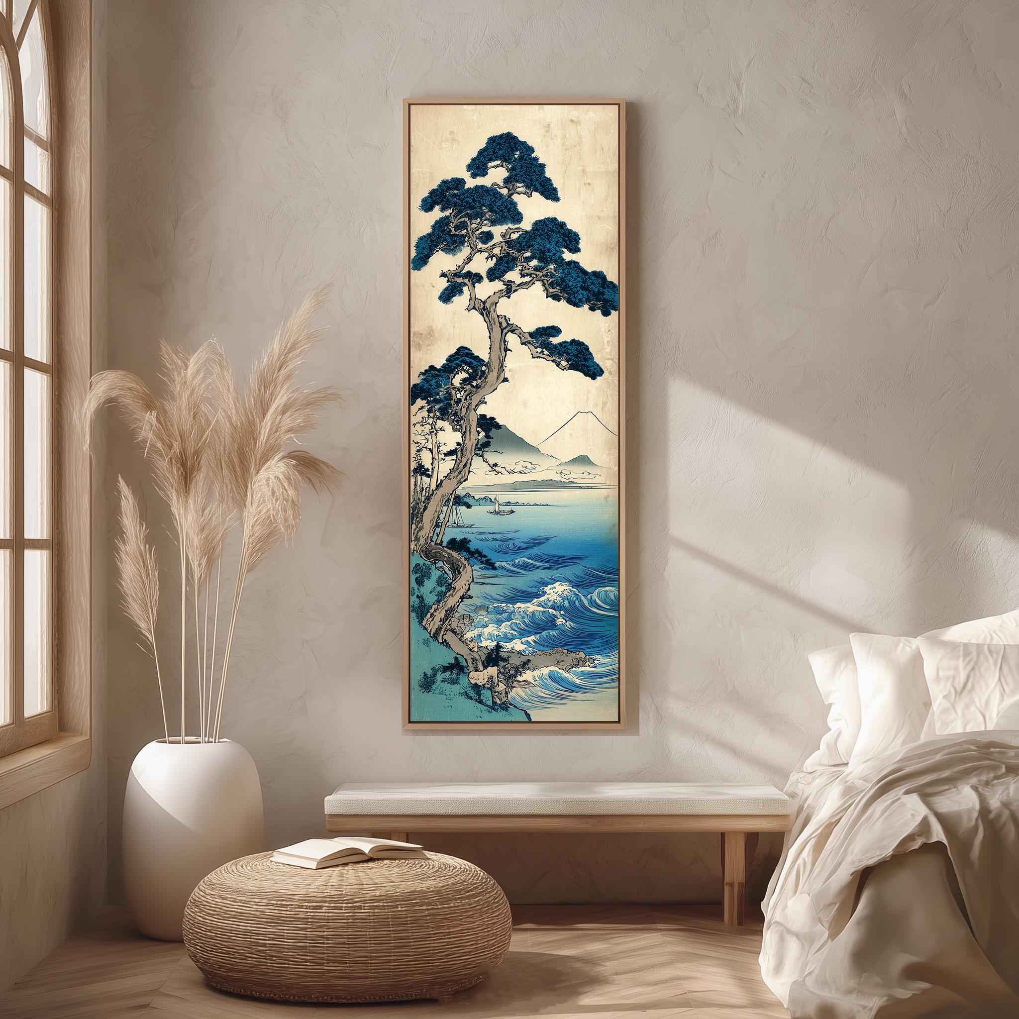 a serene bedroom setting with a large framed painting of a tree and ocean landscape hanging on the wall. The painting is surrounded by a white vase filled with tall, light-colored reeds, and a woven ottoman is placed in front of the painting. The room has a minimalist and calming aesthetic, with a bed and a window providing natural light.
