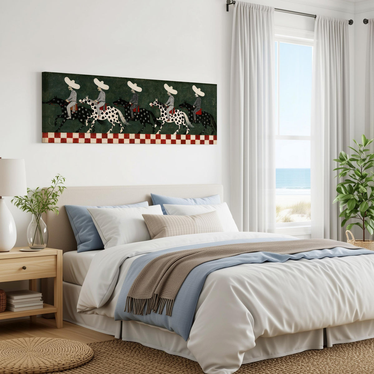 Riders in sombreros on spotted horses panoramic canvas print above a bed in a coastal bedroom