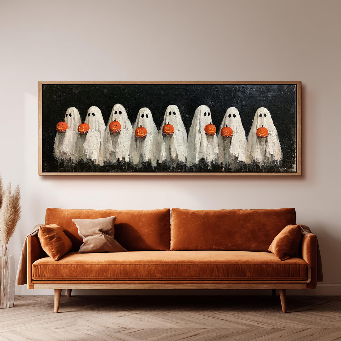 Crowd of huddled ghosts with pumpkins long horizontal canvas print above a sofa in a living room